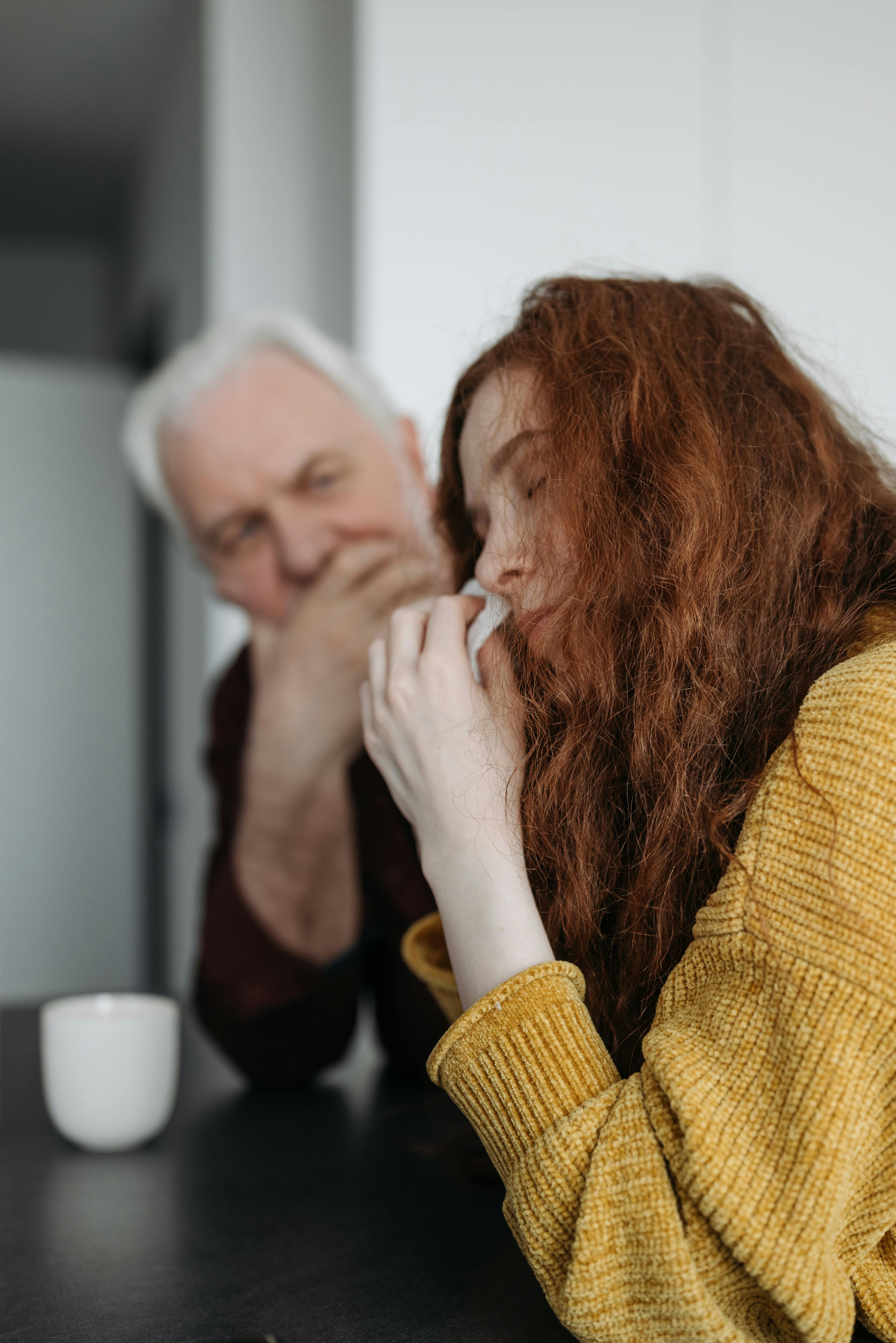 An old man comforting a crying woman | Source: Pexels