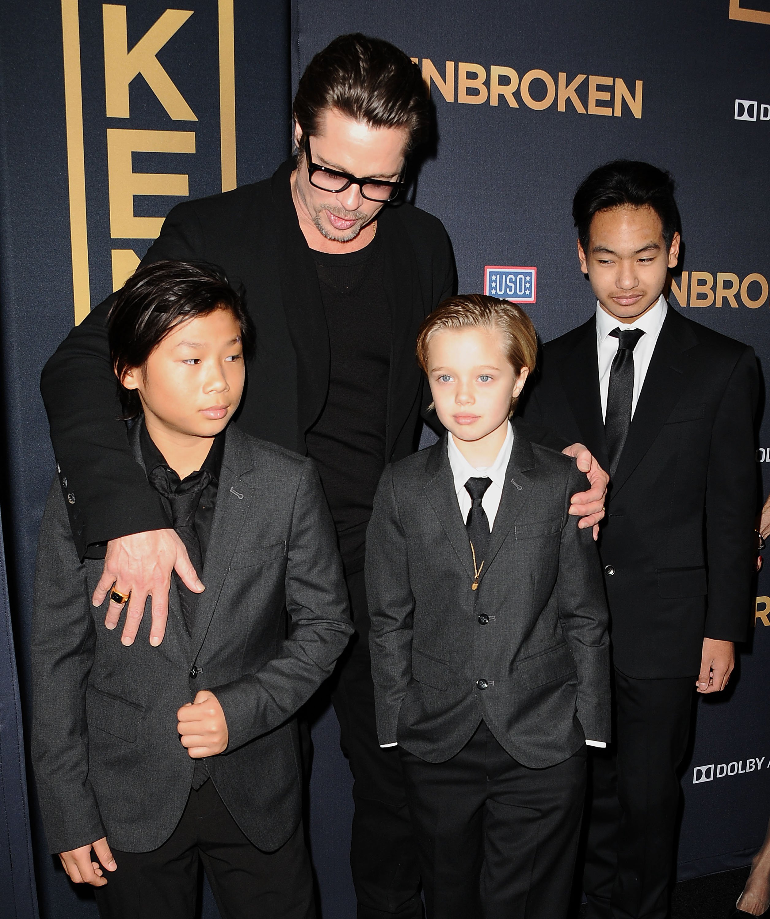 Brad Pitt, Pax Thien Jolie-Pitt, Shiloh Nouvel Jolie-Pitt, and Maddox Jolie-Pitt at TCL Chinese Theatre on December 15, 2014 in Hollywood, California | Source: Getty Images