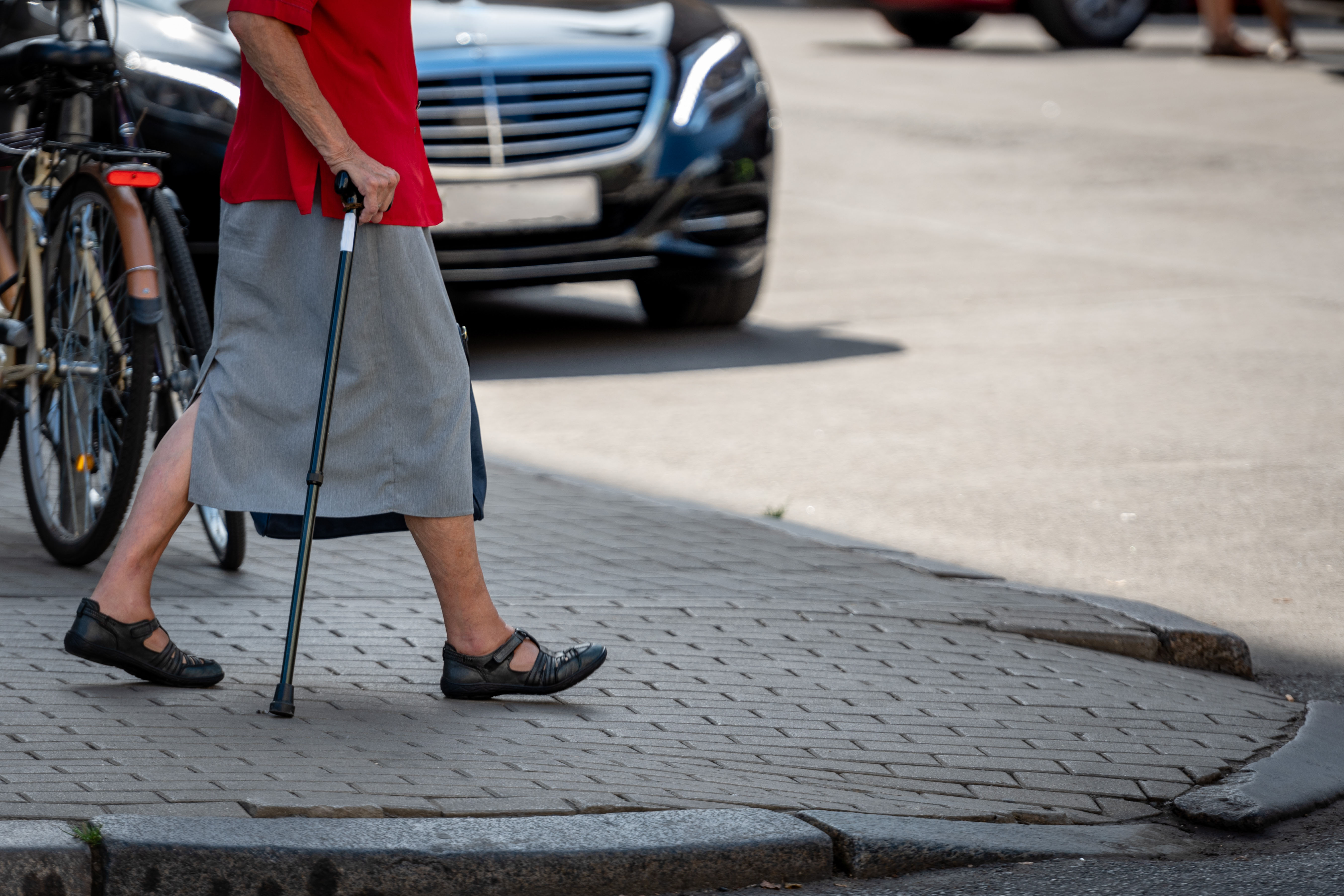 Old woman crossing a street | Source: Shutterstock