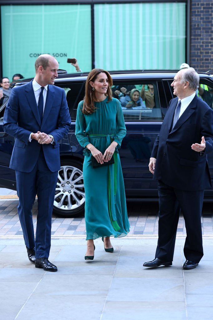Prince William and Kate Middleton are greeted by Prince Shah Karim Al Hussaini, Aga Khan IV during a visit to the Aga Khan Centre. | Source: Getty Images