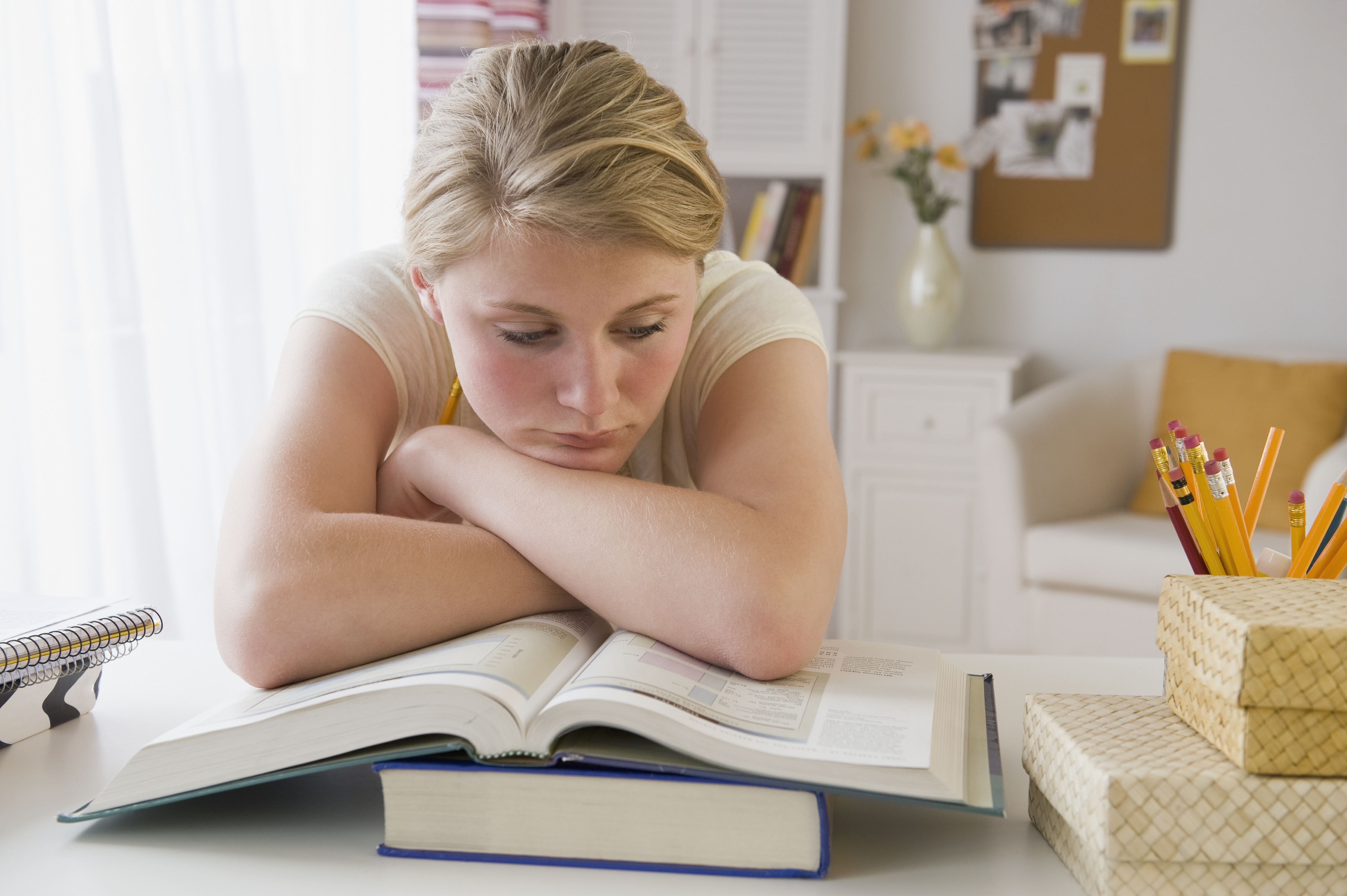 Teenaged girl doing homework | Source: Getty Images