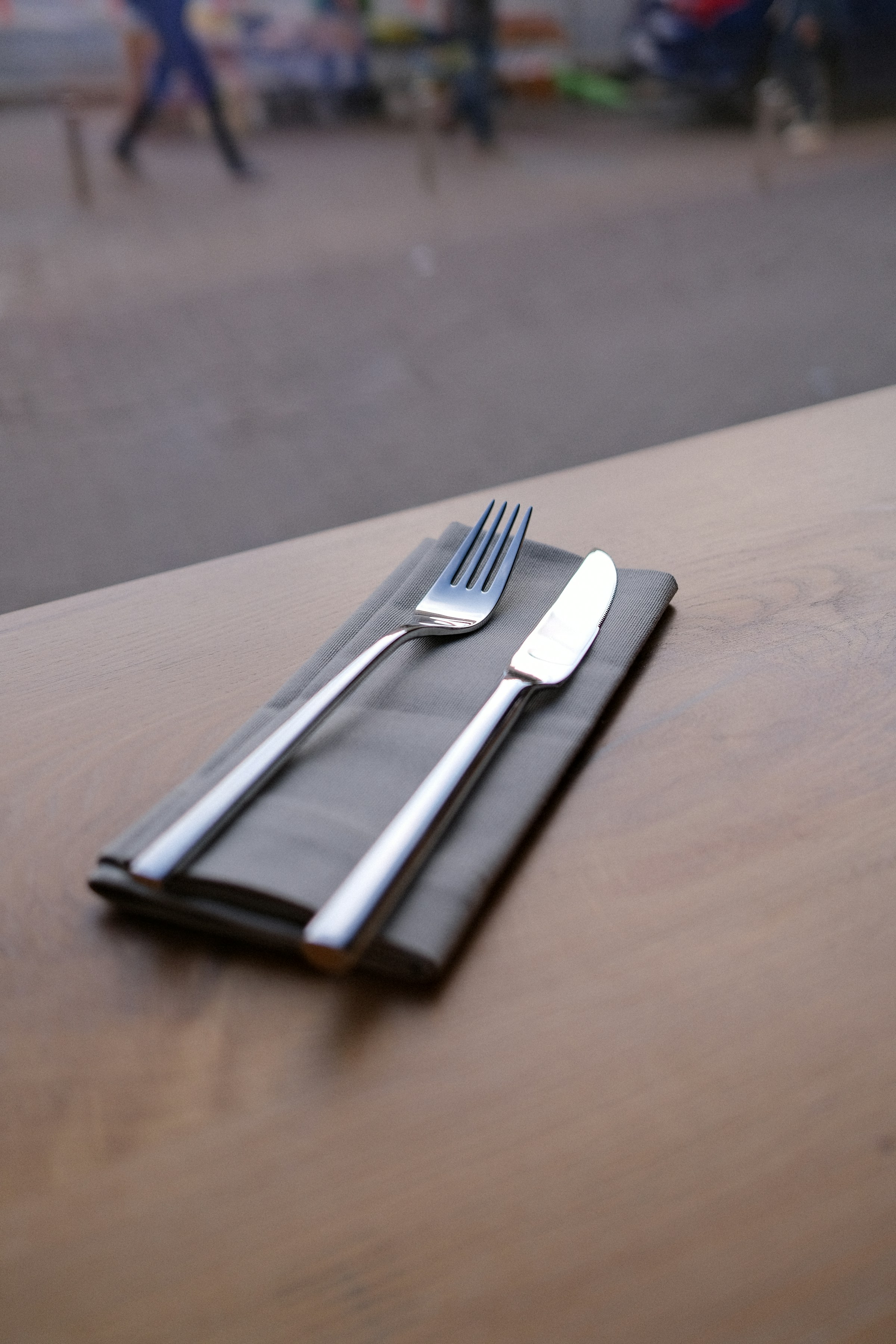 A fork and knife lying on a table | Source: Unsplash