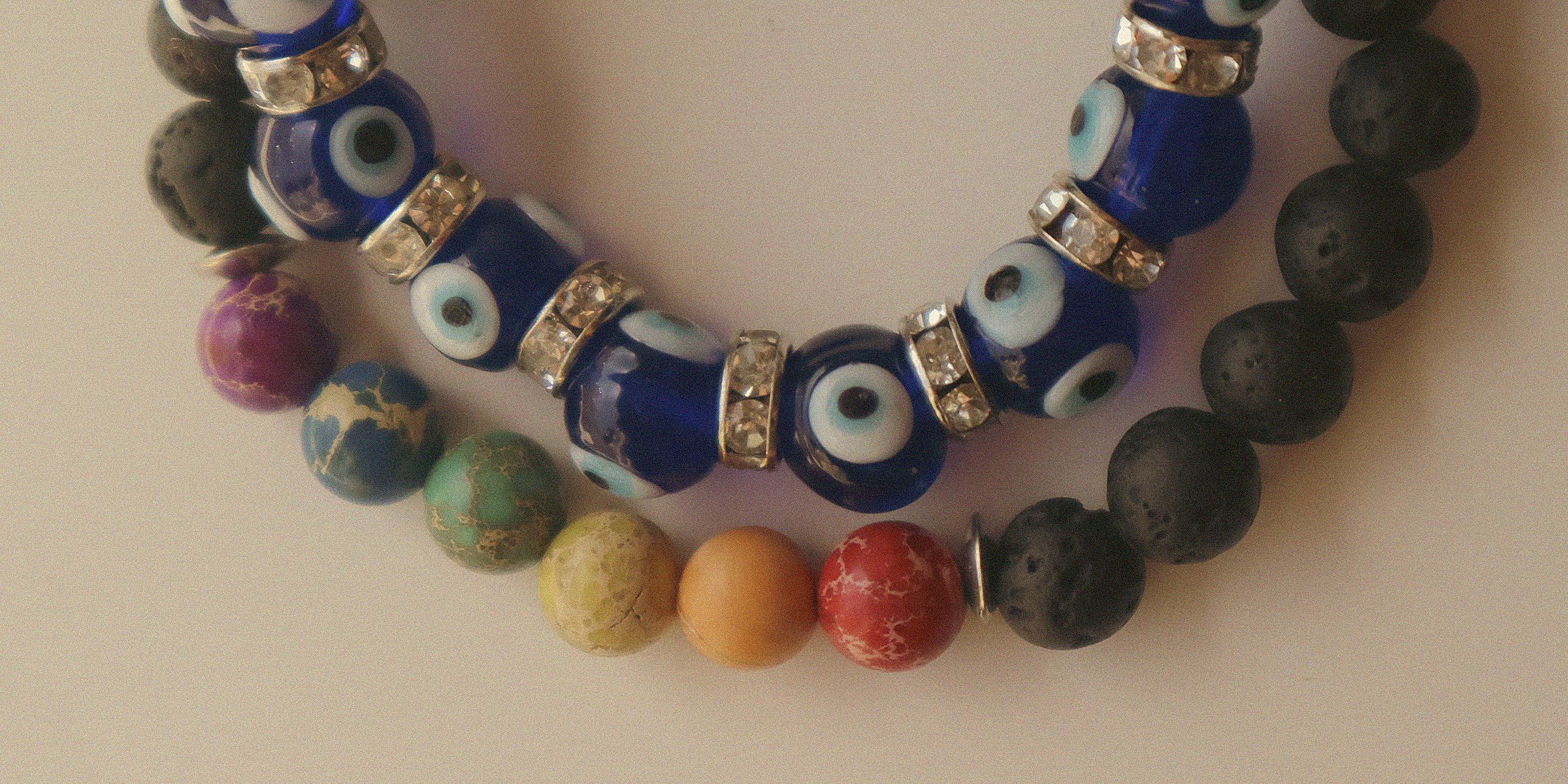 Evil eye beads alongside colorful beads | Source: Unsplash