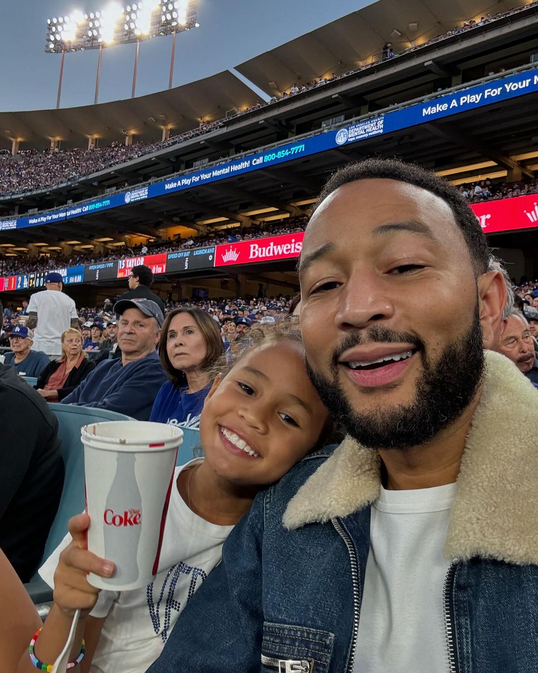 John Legend and Luna at a game between the Los Angeles Dodgers and New York Mets, from a post dated October 22, 2024 | Source: Instagram/johnlegend/