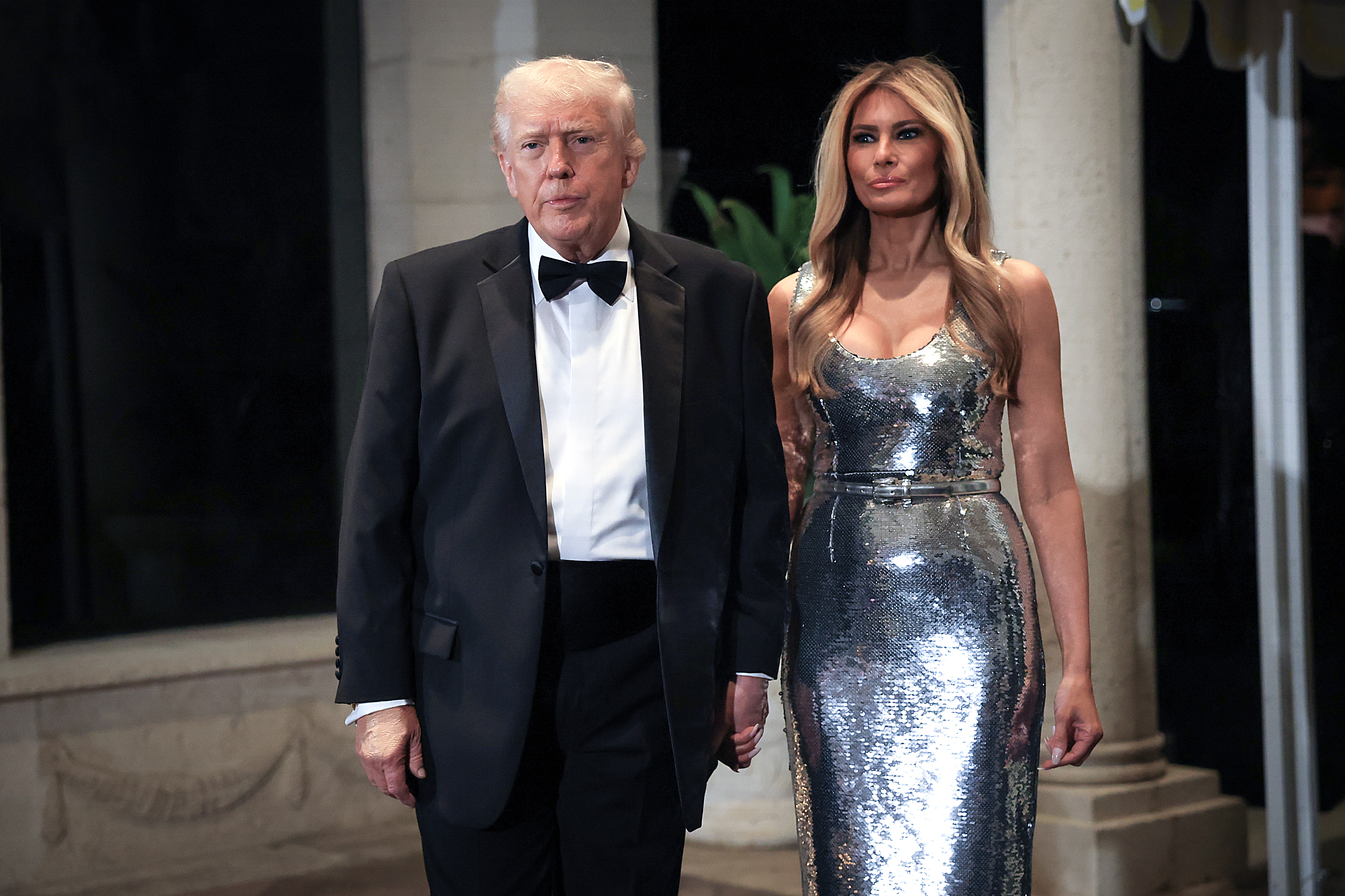 Donald Trump and Melania Trump arrive for a New Year’s Eve event at Mar-a-Lago on December 31, 2025, in Palm Beach, Florida | Source: Getty Images