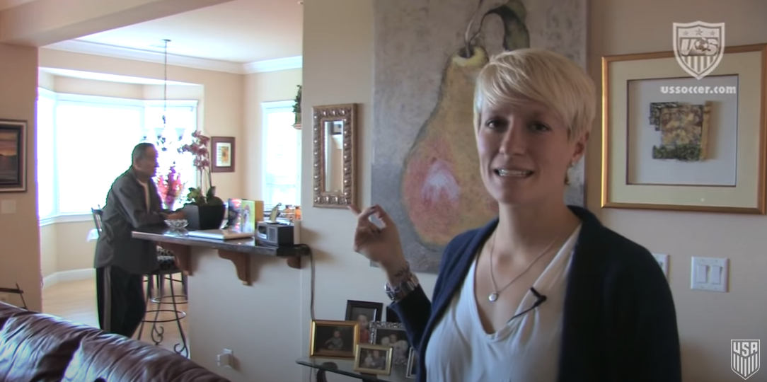Megan Rapinoe showing off her parent's house, living room, and part of the kitchen, where she stayed from age 14 on August 2, 2012, in Redding, California | Source: YouTube/U.S. Soccer
