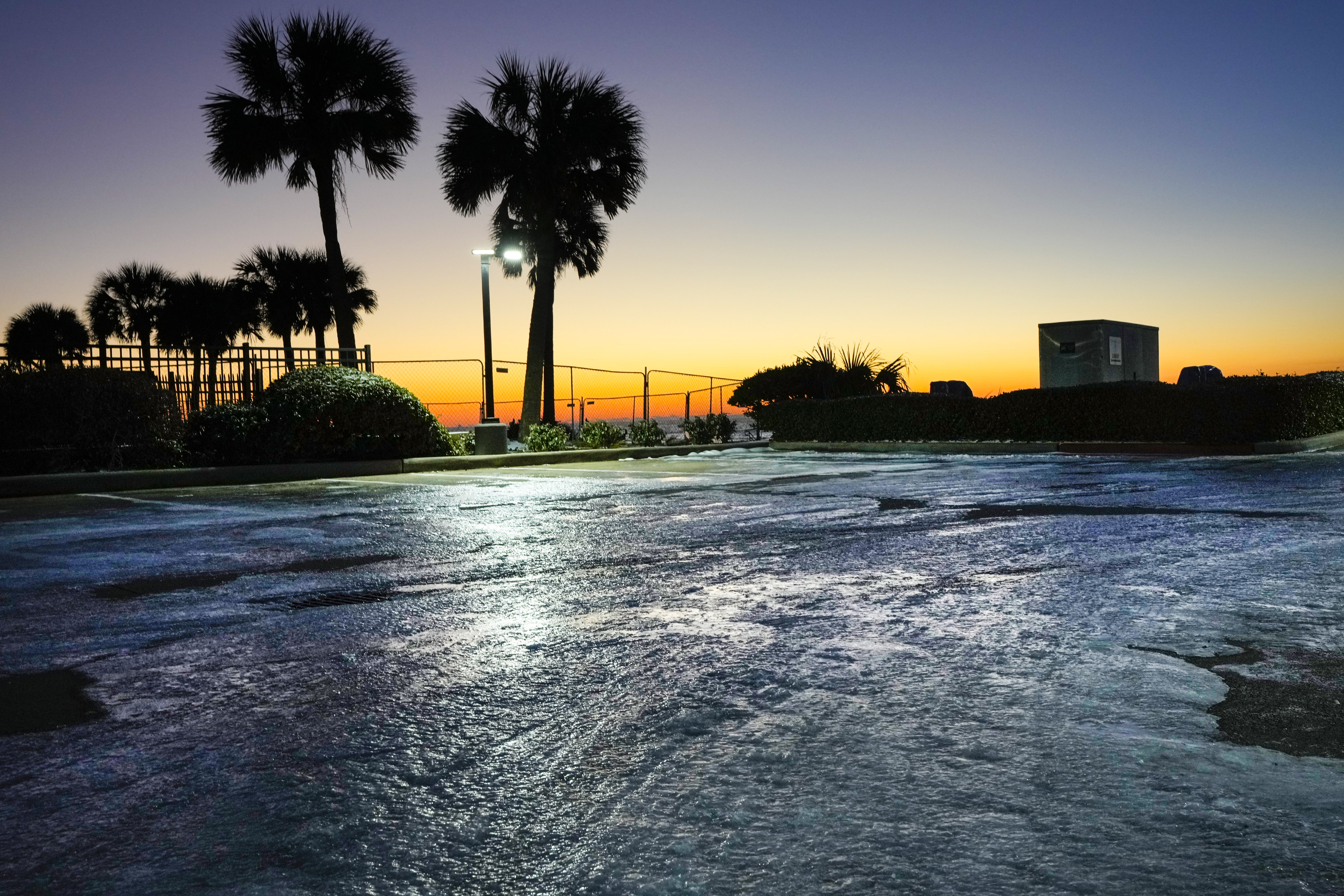 Ice and snow linger as the sun rises over the Gulf of Mexico in Texas on January 22, 2025 | Source: Getty Images