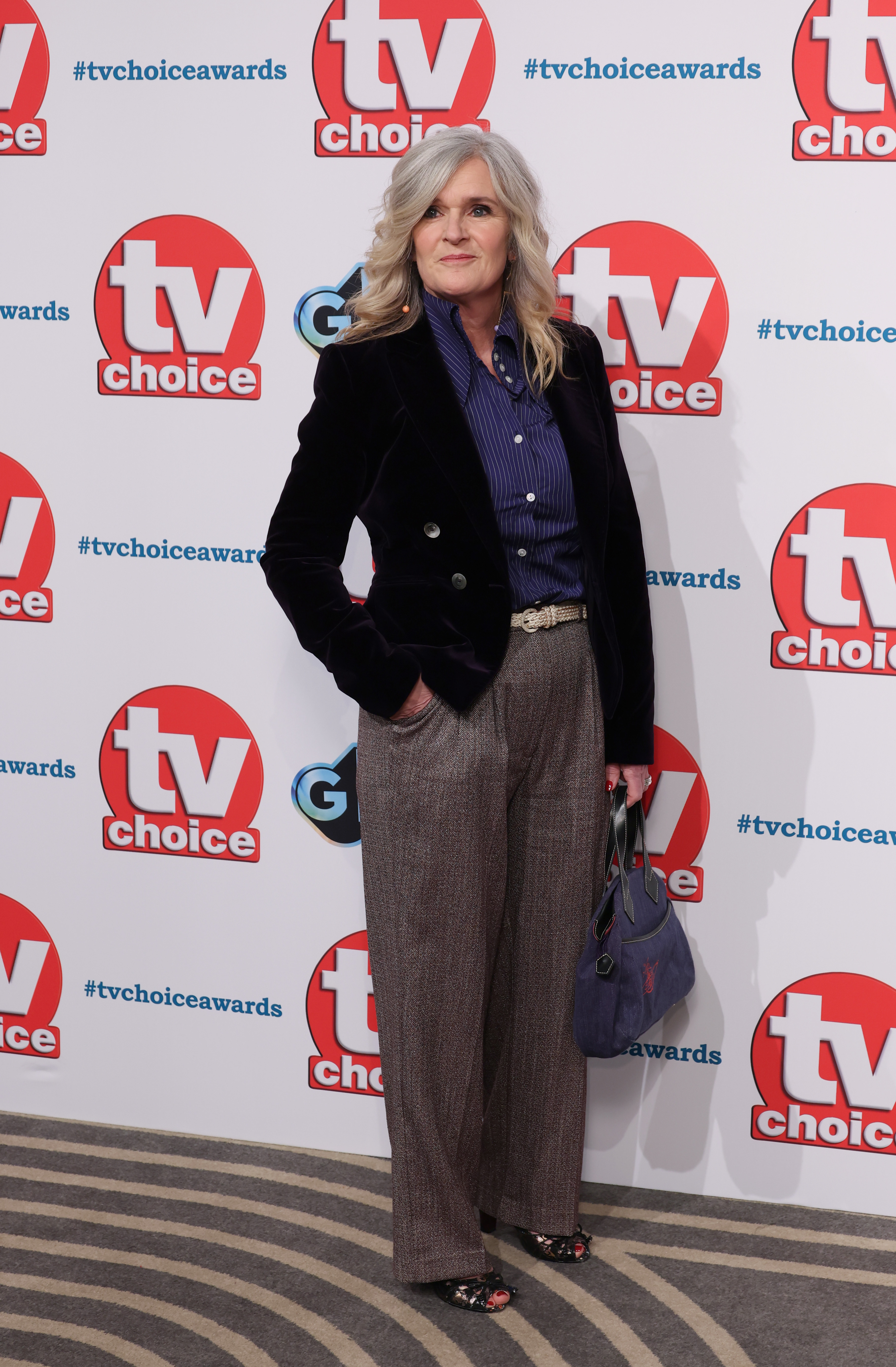 At the TV Choice Awards in 2025, Finneran stepped out with striking silver-blonde waves and a polished, modern ensemble. Her tailored velvet blazer, pinstriped shirt, and wide-leg trousers signaled a confident evolution in style, reflecting her continued presence in British television more than a decade after her Downton days.