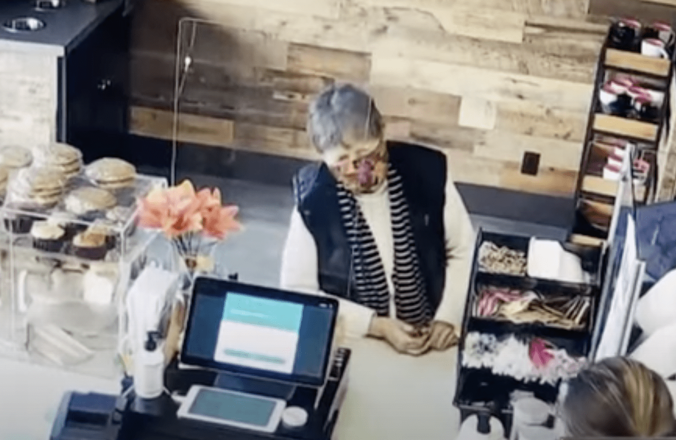 80-year-old woman paying for her coffee before losing her wallet which a homeless man found and returned. |  Photo: youtube.com/NBC Bay Area  