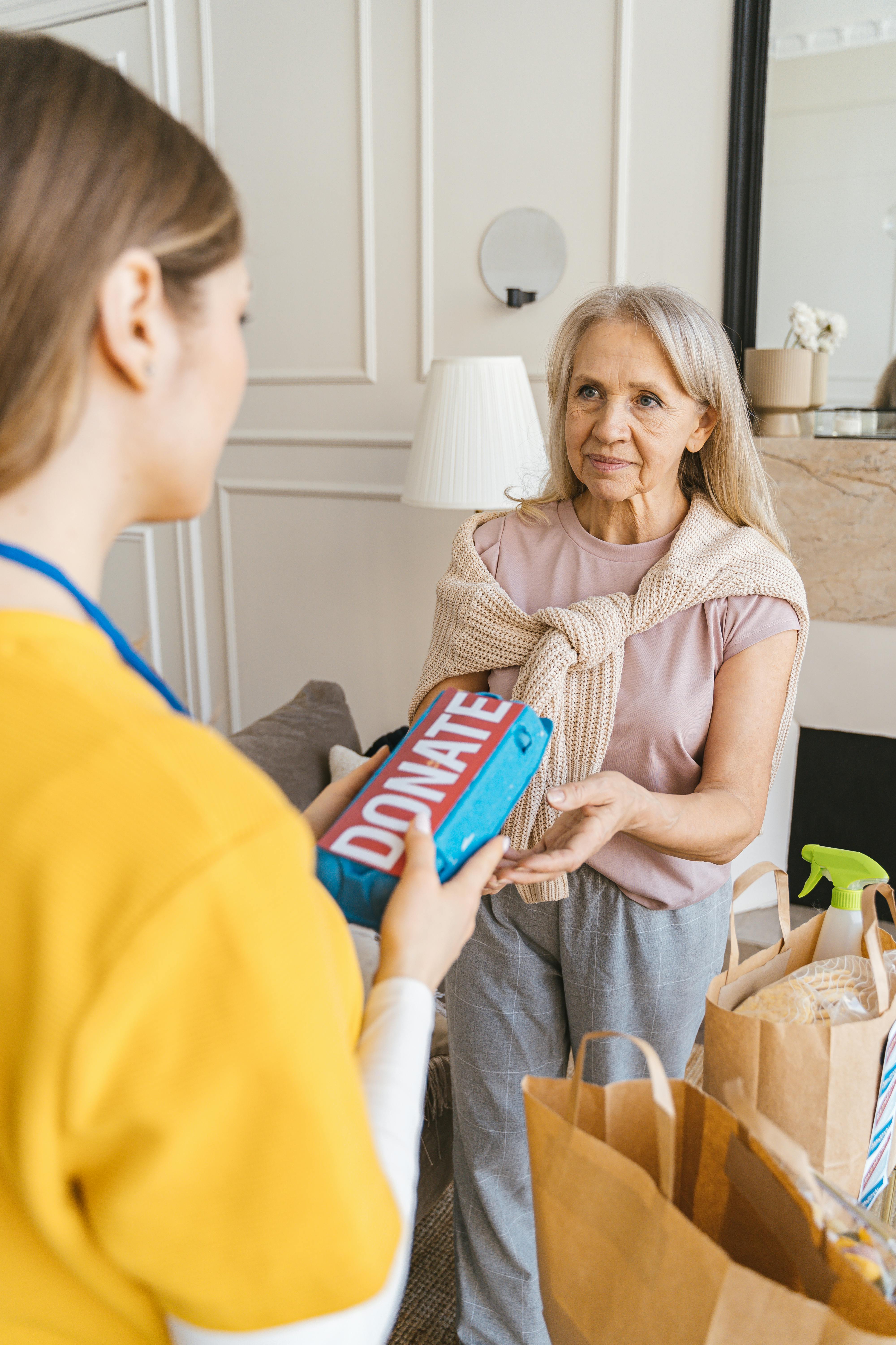 A woman receiving a donation | Source: Pexels