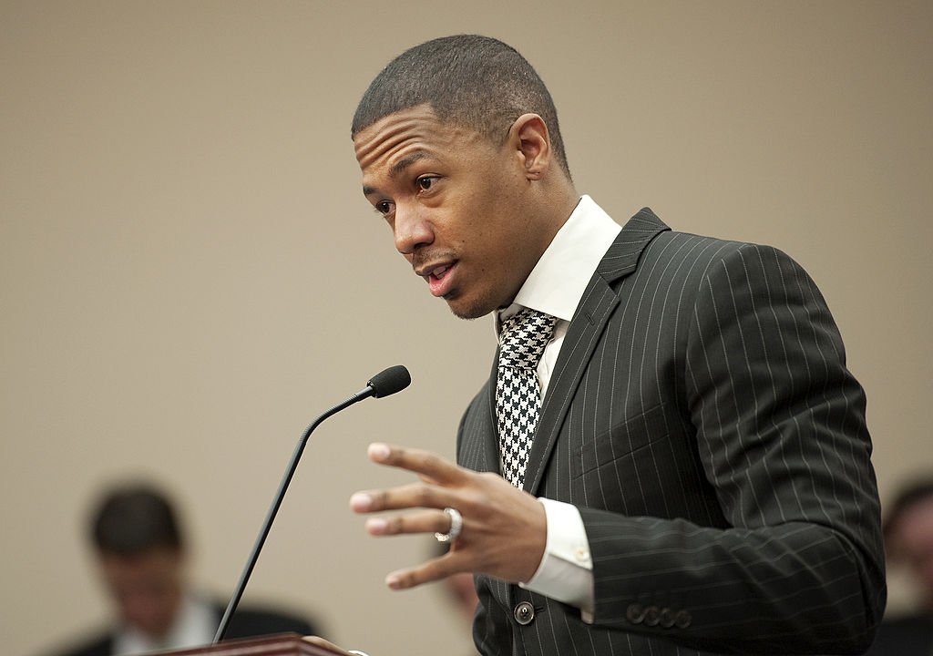 Nick Cannon stands at a podium as the spokesperson for Safe Communications, speaks at a Bi-Partisan Privacy Caucus briefing on March 2, 2012 | Source: Getty Images (Photo By Chris Maddaloni/CQ Roll Call)