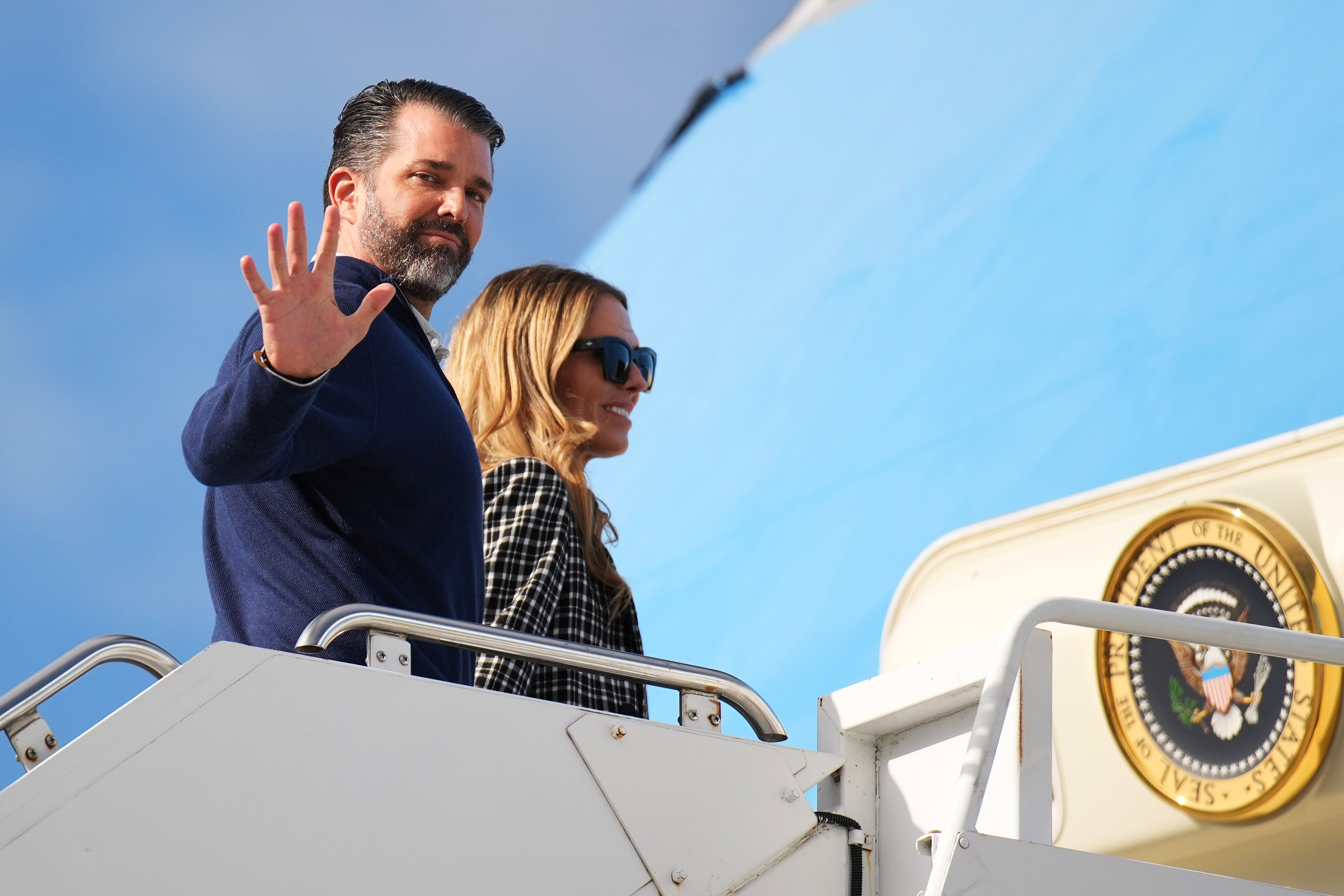 Donald Trump Jr. and Bettina Anderson prepare to board Air Force One at RAF Lossiemouth on July 29, 2025, in Lossiemouth, Scotland | Source: Getty Images