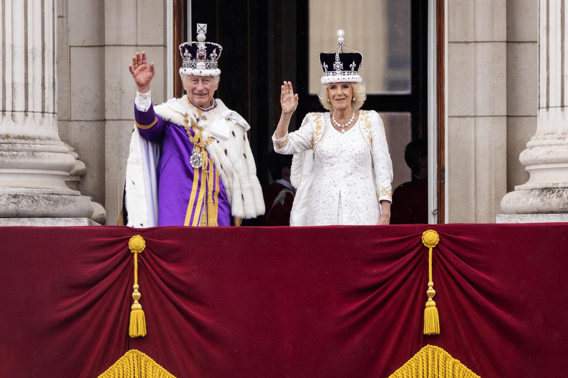 King Charles III and Queen Camilla wave from the Buckingham Palace balcony after their coronation in lLondon on May 6, 2023 | Source: Getty Images