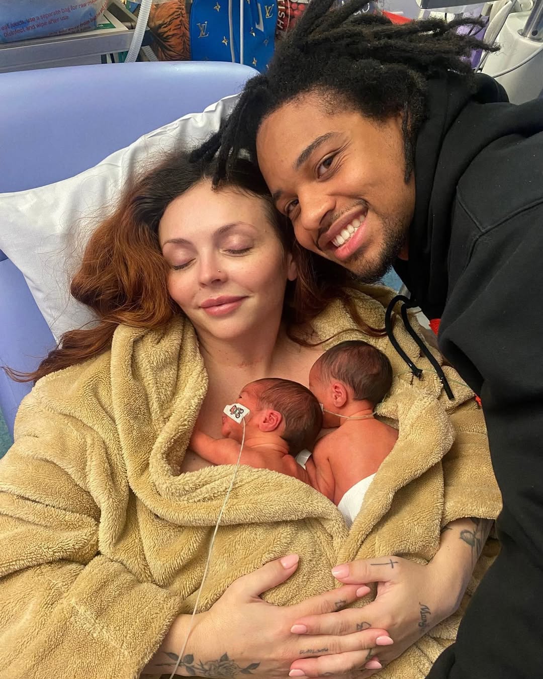 Jesy Nelson rests in a hospital bed, cradling newborn twins Ocean Jade and Story Monroe against her chest, as fiancé Zion Foster leans in close — his proud smile capturing the awe of their first moments as a family of four. | Source: Instagram/jesynelson