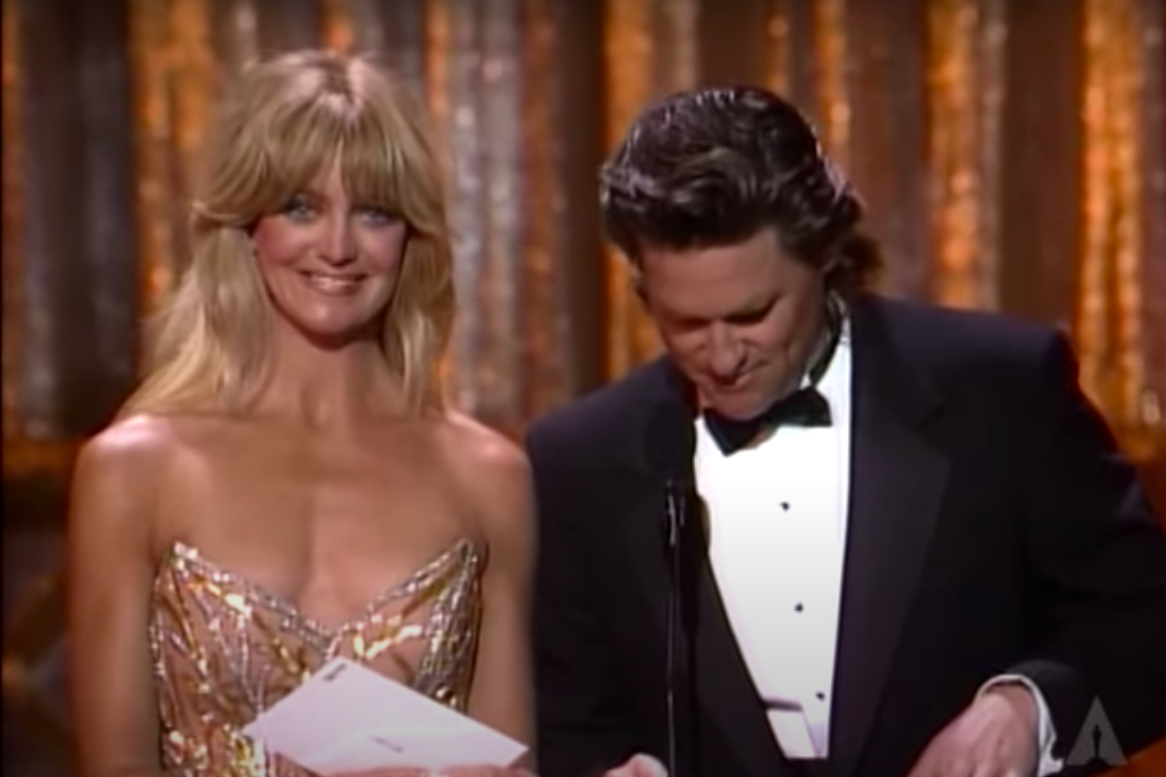A screenshot of a YouTube video of Goldie Hawn and Kurt Russell presenting the nominees for Best Director at the 1989 Oscars posted on September 23, 2014 | YouTube.com/Oscars