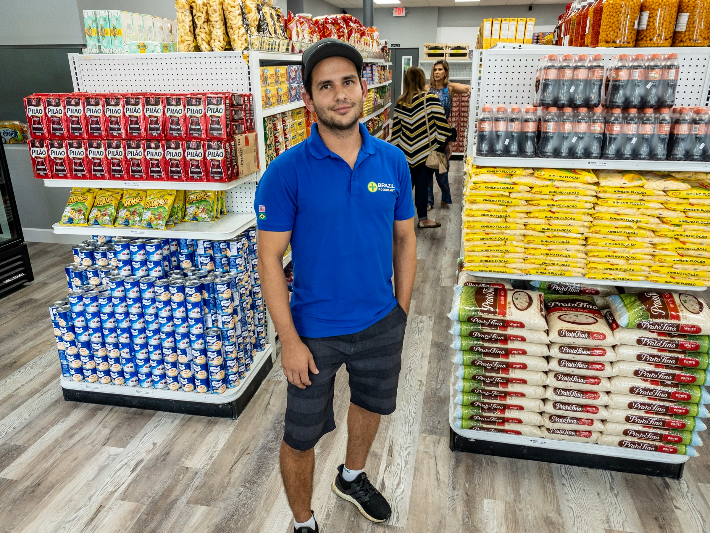 A man in a uniform standing in a grocery store | Source: Unsplash