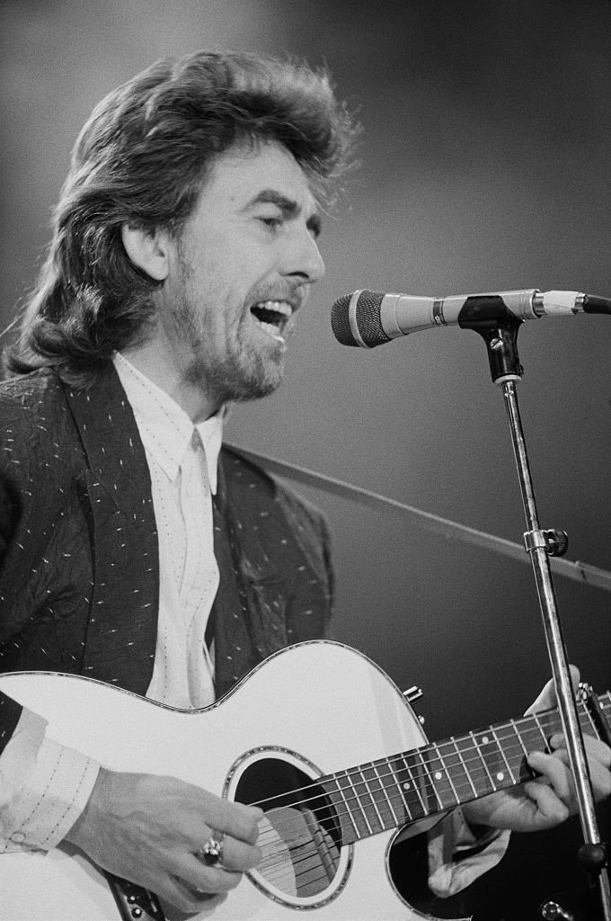 Former Beatle George Harrison (1943 - 2001) performing at the Prince's Trust Concert, Wembley Arena, London | Getty Images / Global Images Ukraine Former Beatle George Harrison (1943 - 2001) performing at the Prince's Trust Concert, Wembley Arena, London | Getty Images / Global Images Ukraine
