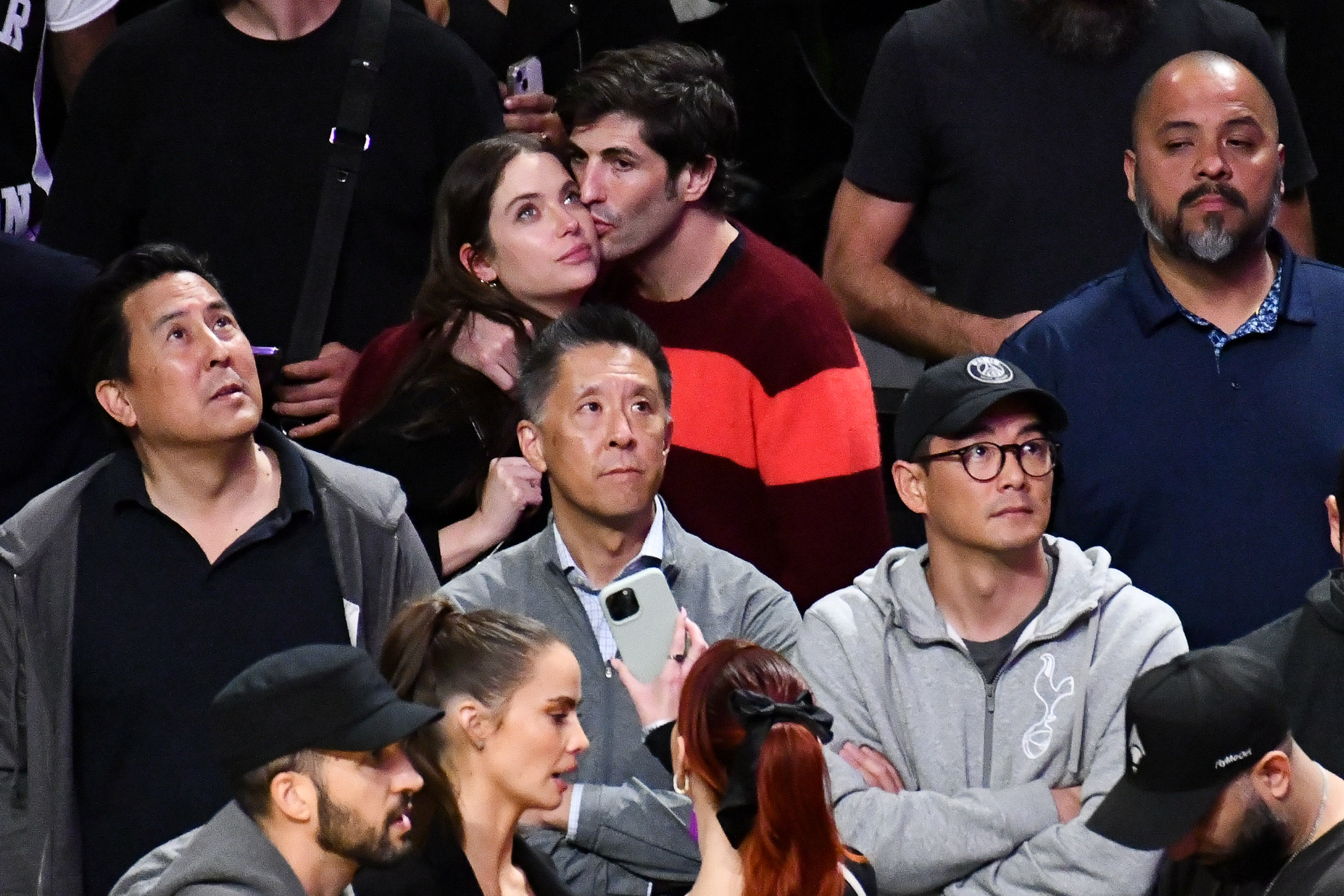 Ashley Benson (top left) and Brandon Davis attend a basketball game between the Los Angeles Lakers and the Orlando Magic at Crypto.com Arena on October 30, 2023 in Los Angeles, California. | Source: Getty Images