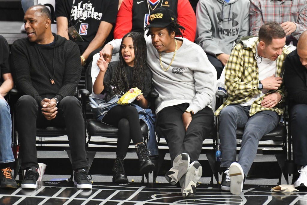 Jay-Z and Blue Ivy Carter attend a basketball game between the Los Angeles Clippers and the Los Angeles Lakers at Staples Center on March 08, 2020. | Photo: Getty Images