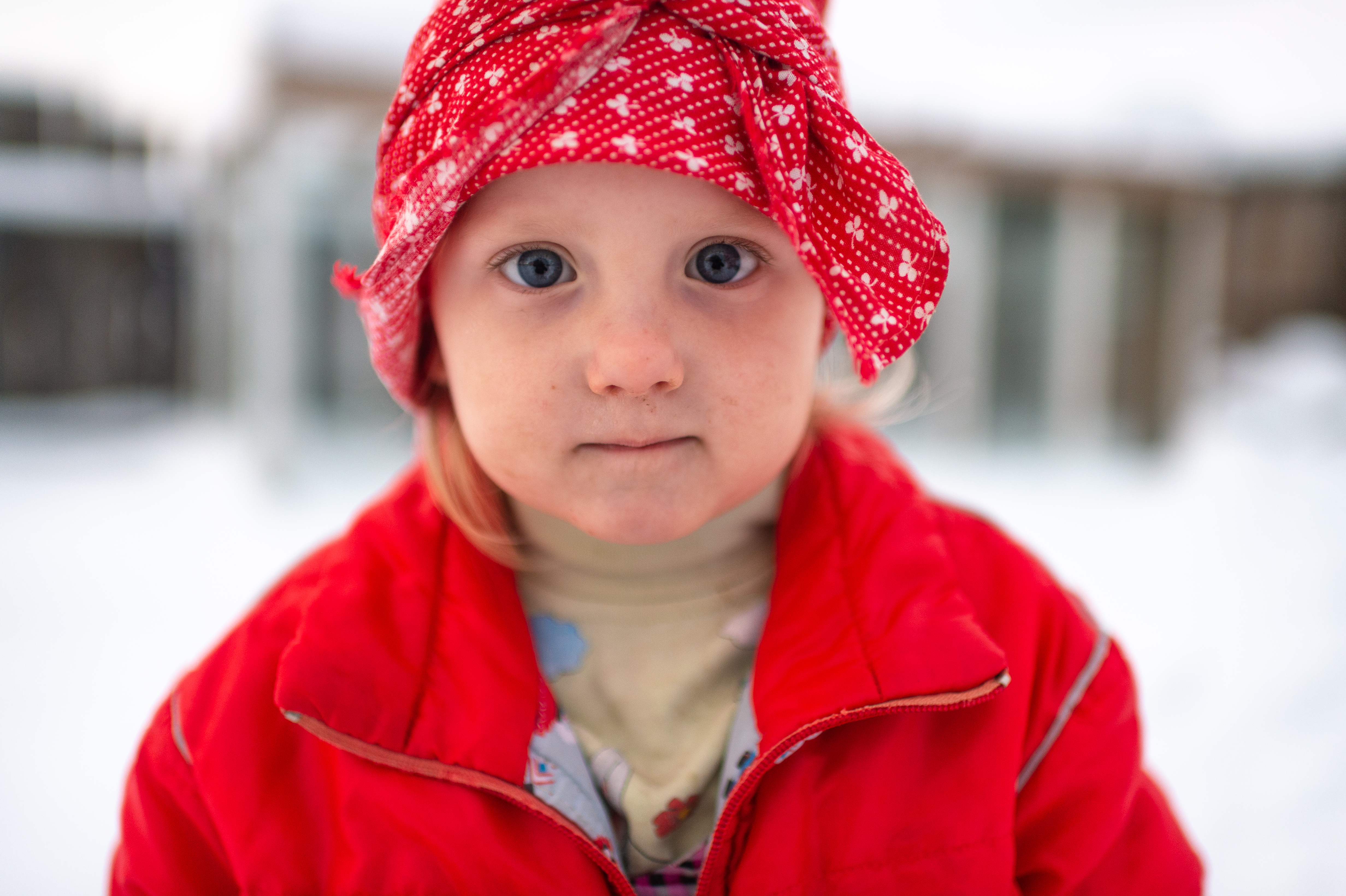 A child in a red coat | Source: Shutterstock