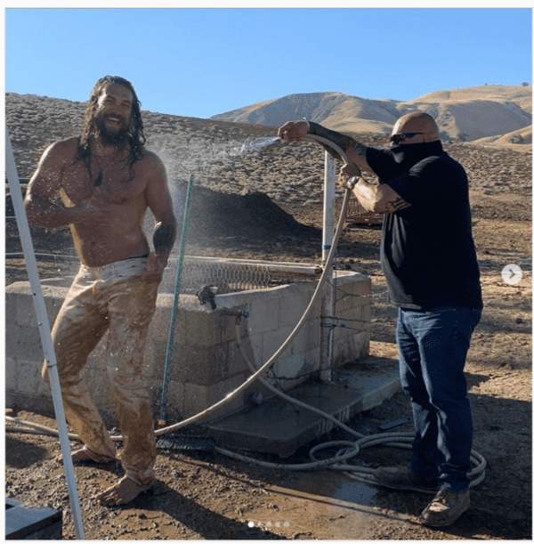 Actor Jason Momoa being hosed down by a hotel staff. | instagram.com/prideofgypsies