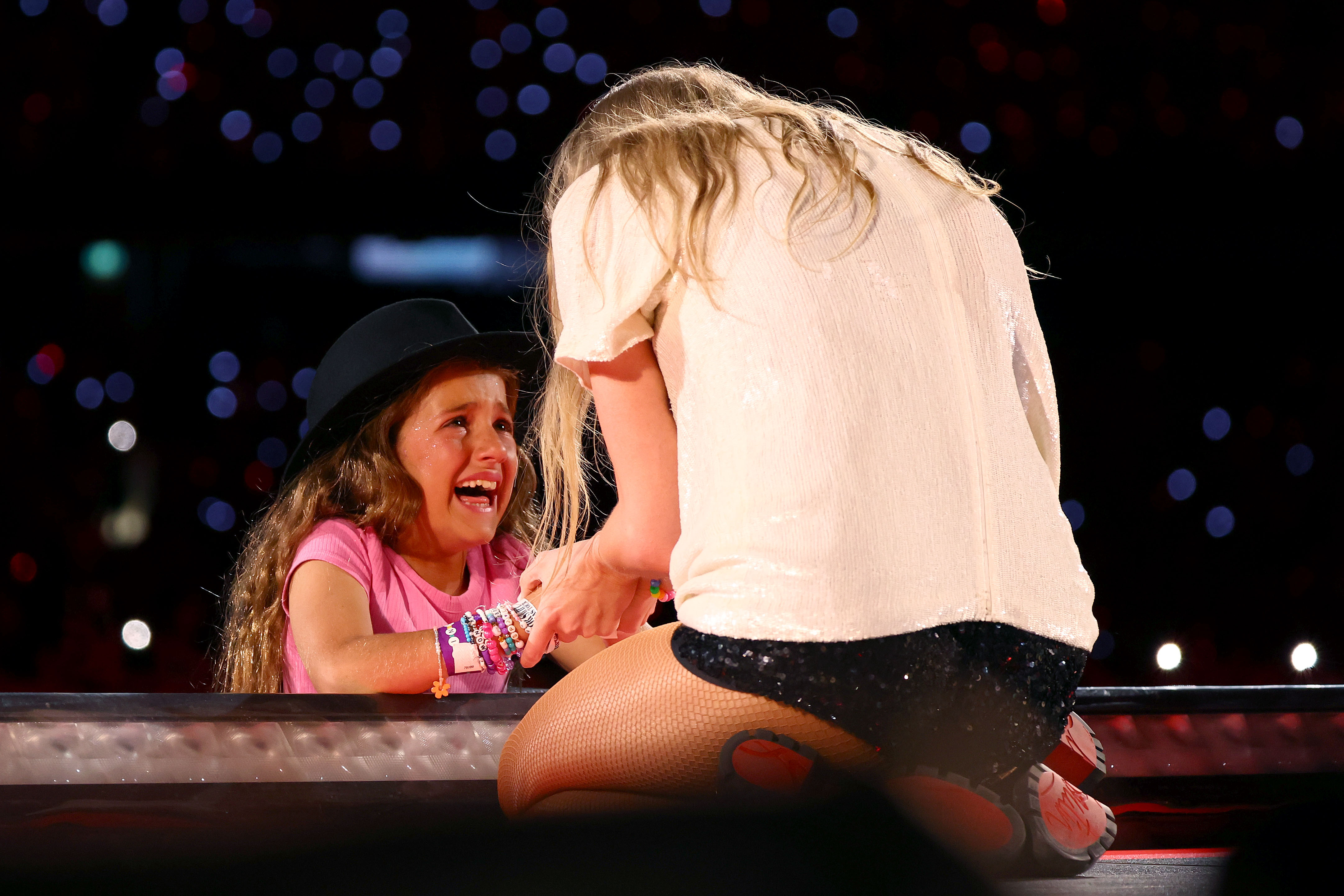 A young fan reacts after receiving a hat from Taylor Swift at Melbourne Cricket Ground in Melbourne, Australia, on February 16, 2024. | Source: Getty Images