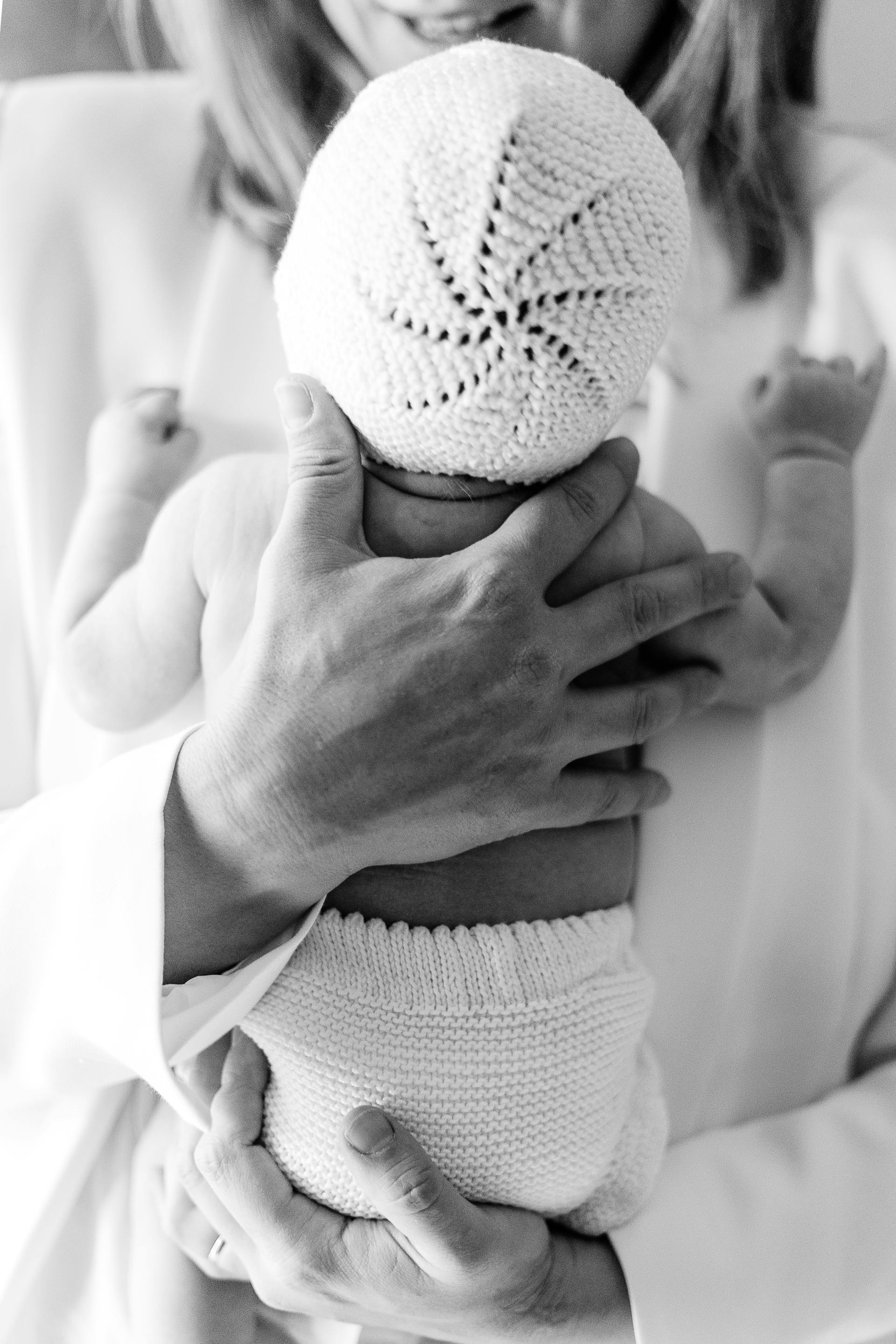 Grayscale of a mother holding her newborn baby | Source: Pexels