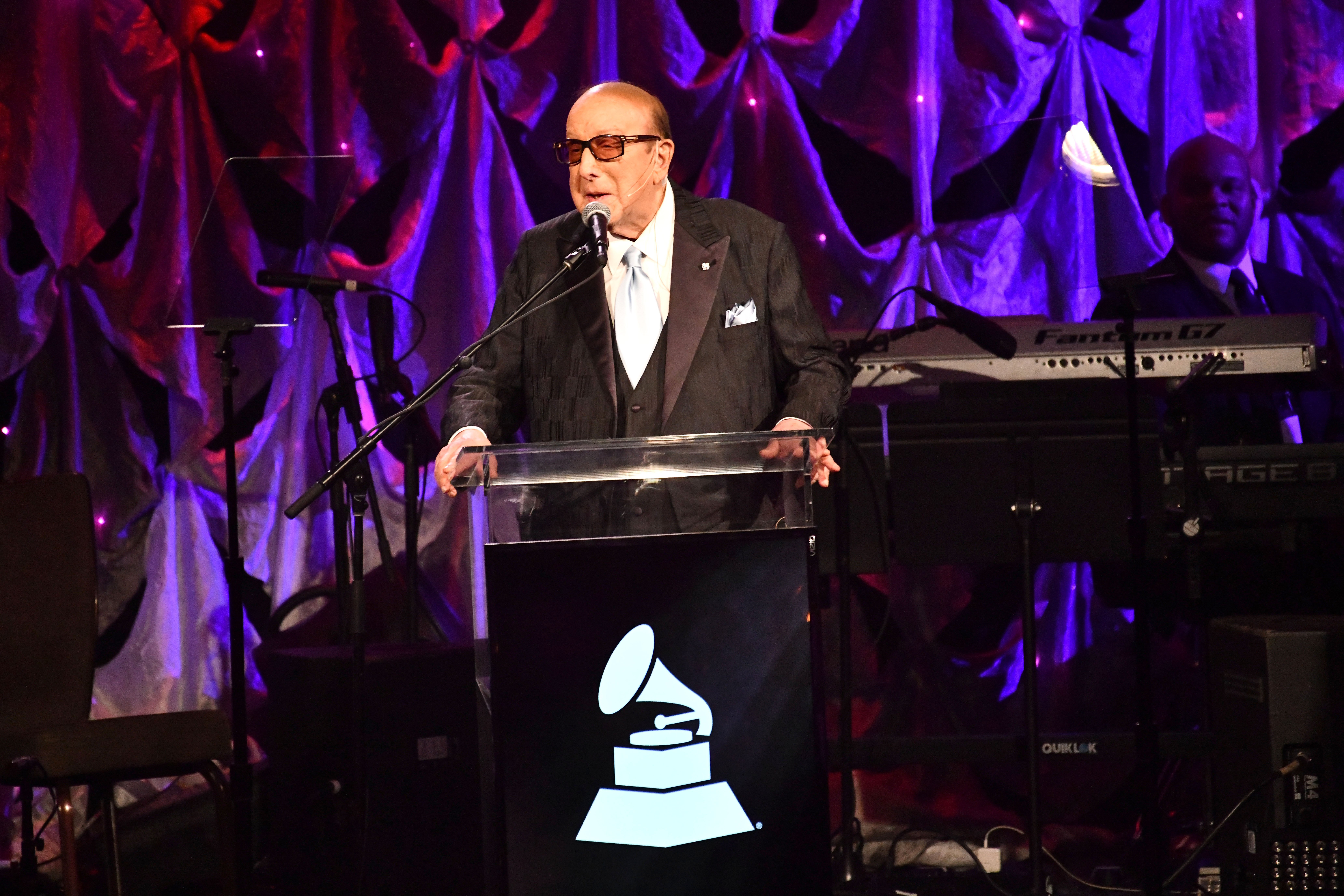 Musical Producer Clive Davis delivering a speech at the pre-Grammys party | Photo: Getty Images