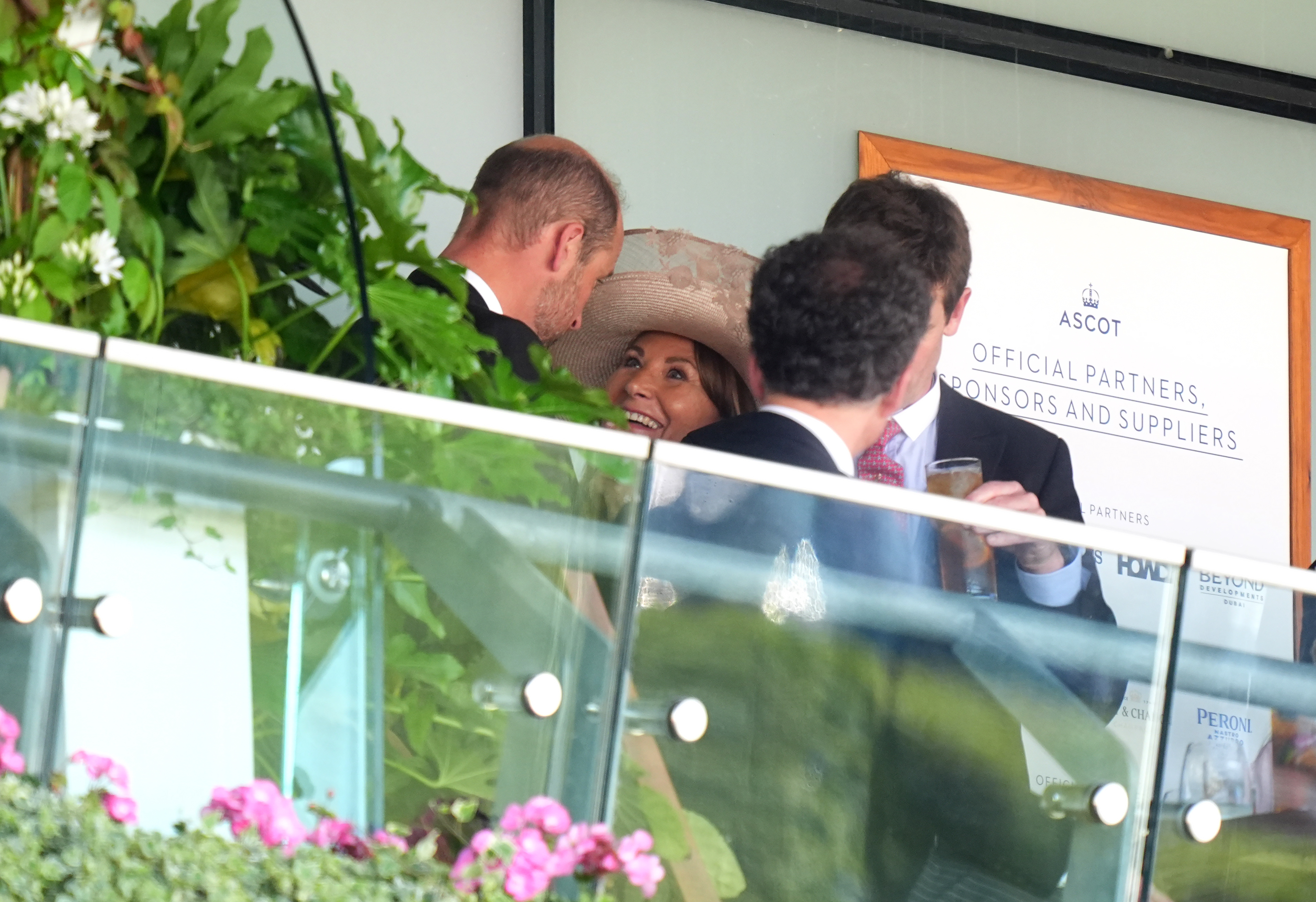 Carole Middleton smiles warmly at Prince William as the two engage in a lively conversation during the Queen’s Vase on day two of Royal Ascot on June 18, 2025, in Berkshire, England.