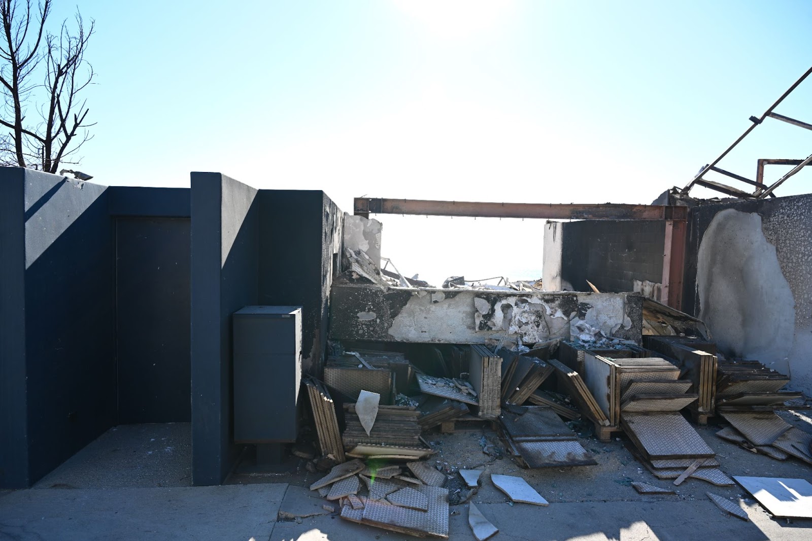 A view of debris of a Malibu Beach home during the Los Angeles wildfires in California on January 12, 2025. | Source: Getty Images