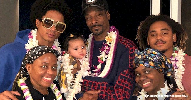 Snoop Dogg glows with pride holding his granddaughter in photo with 3 look-alike kids and wife