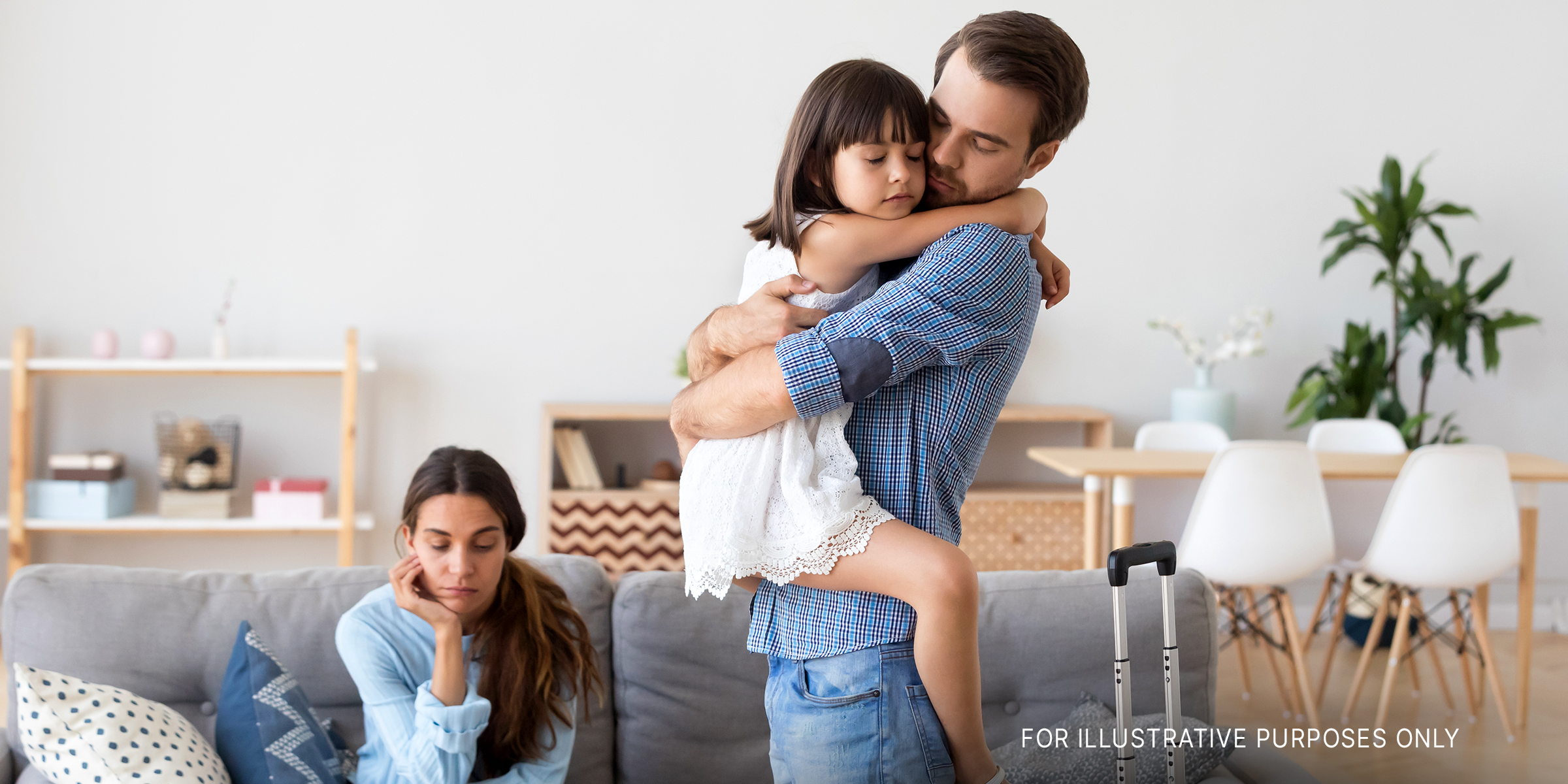 A man holding his young sister with his sad girlfriend in the background | Source: Shutterstock