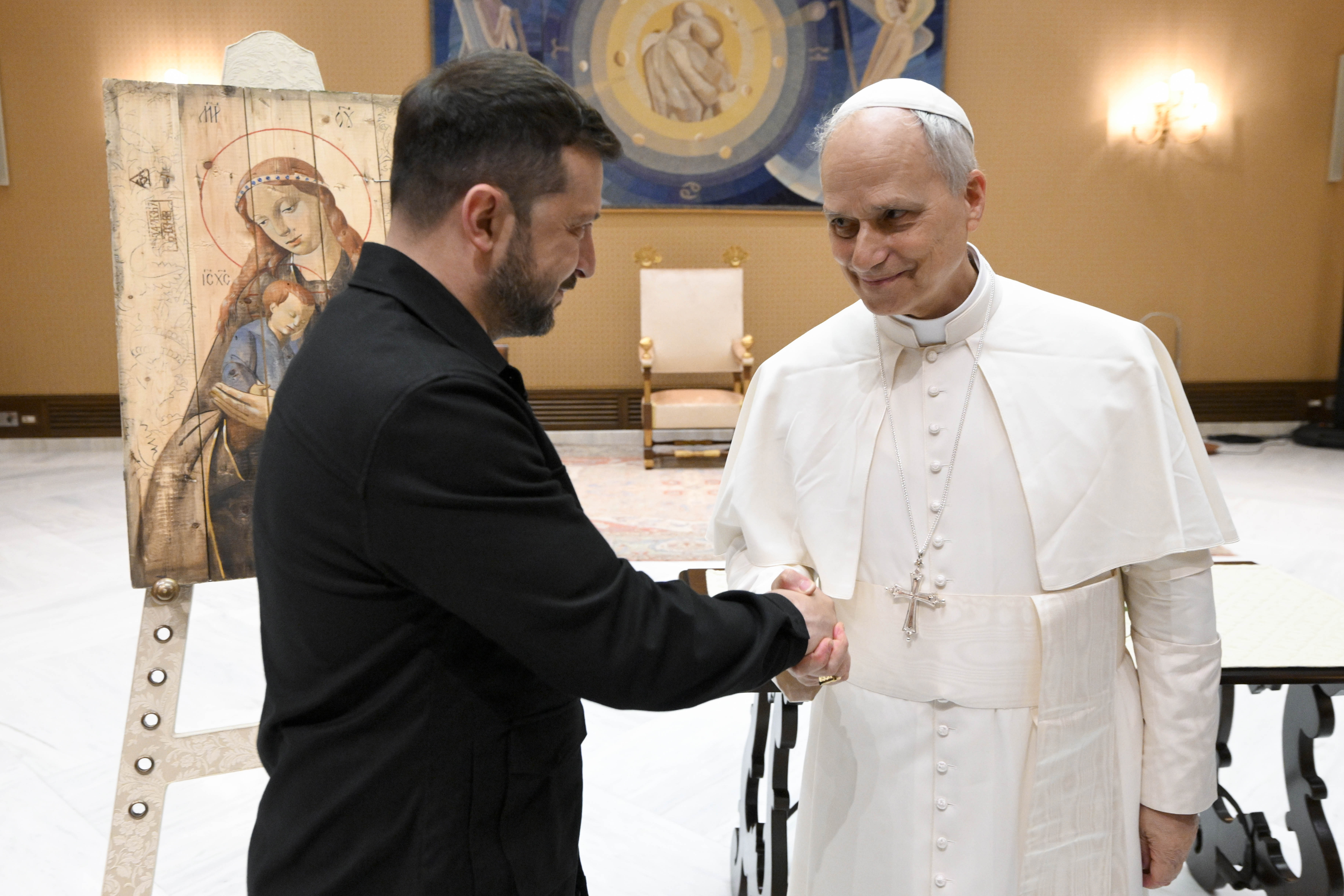 Ukrainian President Volodymyr Zelenskyy shakes hands with Pope Leo XIV during a meeting at the Vatican following the Inauguration Mass in St. Peter's Square on May 18, 2025, in Vatican City. | Source: Getty Images