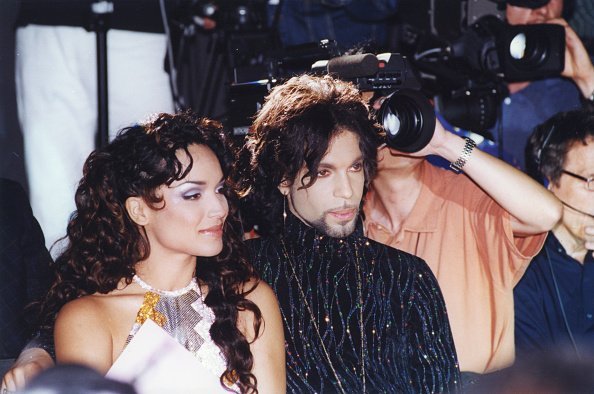 Prince and Mayte Garcia at the défilé Versace à Paris on 15 July 1999, in France | Photo: Getty Images