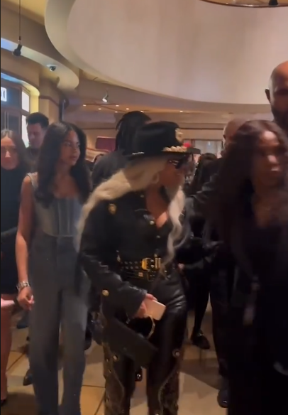 Blue Ivy Carter dons a denim corset and jeans, following behind her mother, Beyoncé, as they walk through the iHeartRadio building. | Source: Tiktok/enews