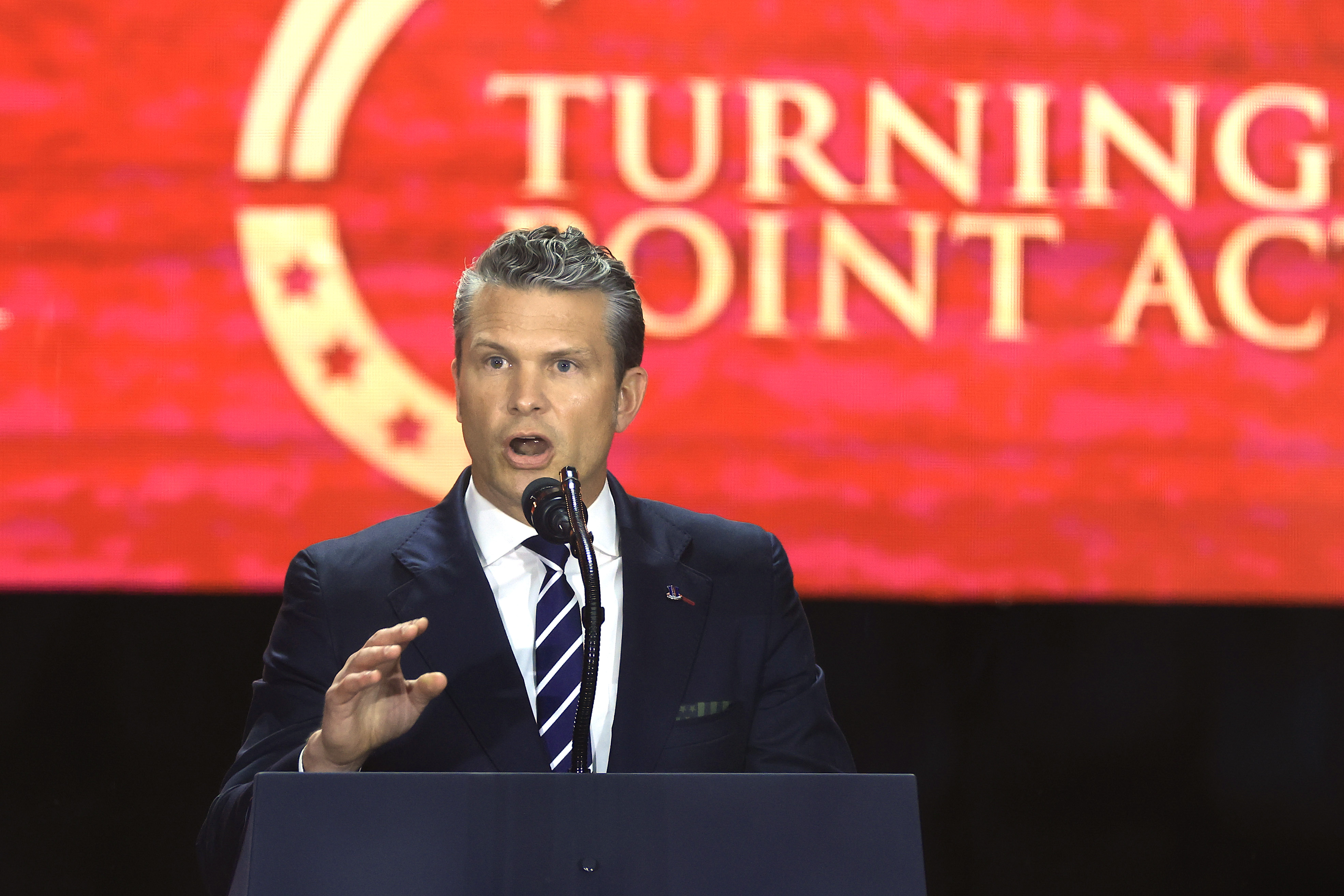 U.S. Secretary of War Pete Hegseth speaks during the public memorial service for Charlie Kirk at State Farm Stadium on September 21, 2025 | Source: Getty Images
