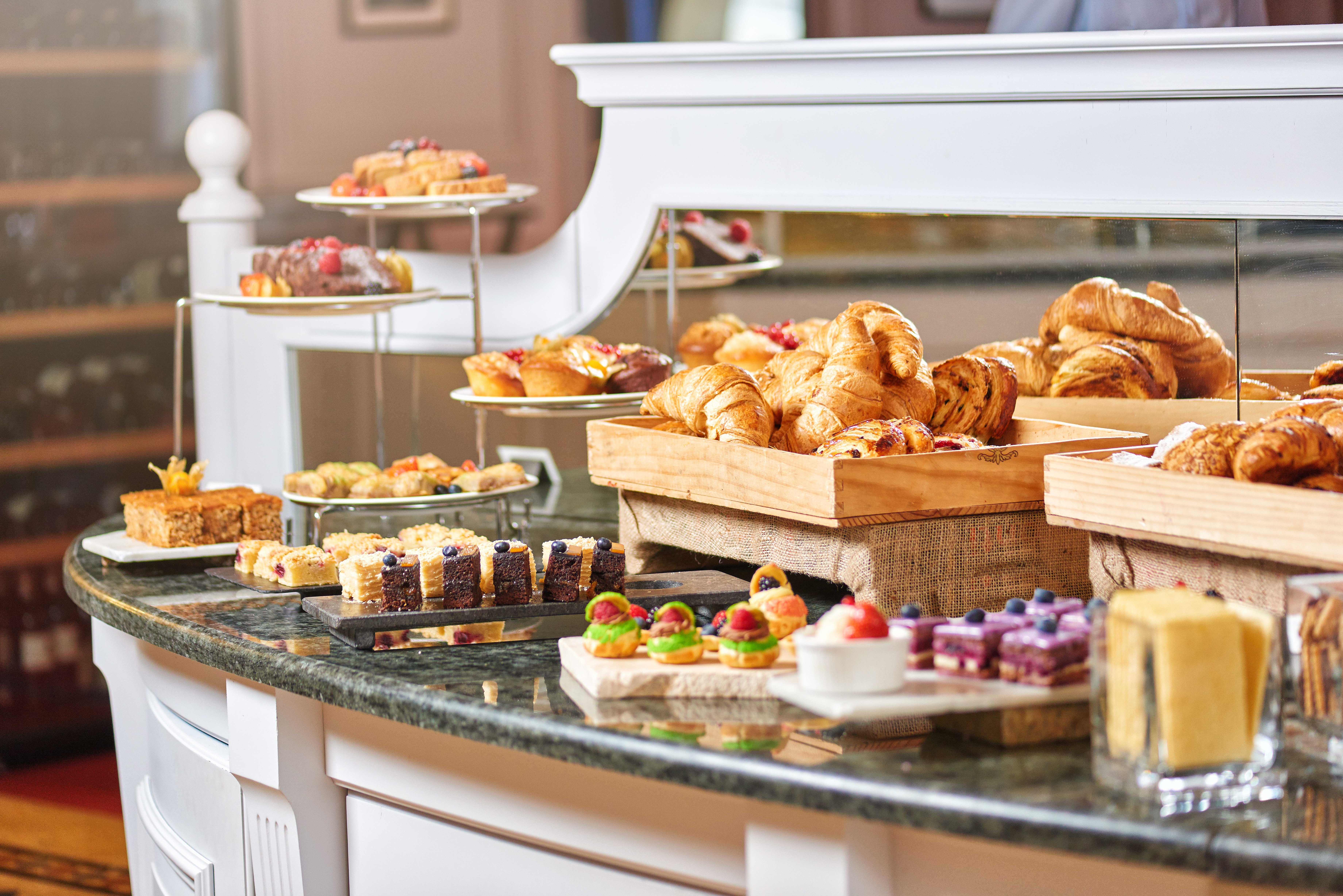 Bread and pastries at a hotel breakfast | Source: Shutterstock