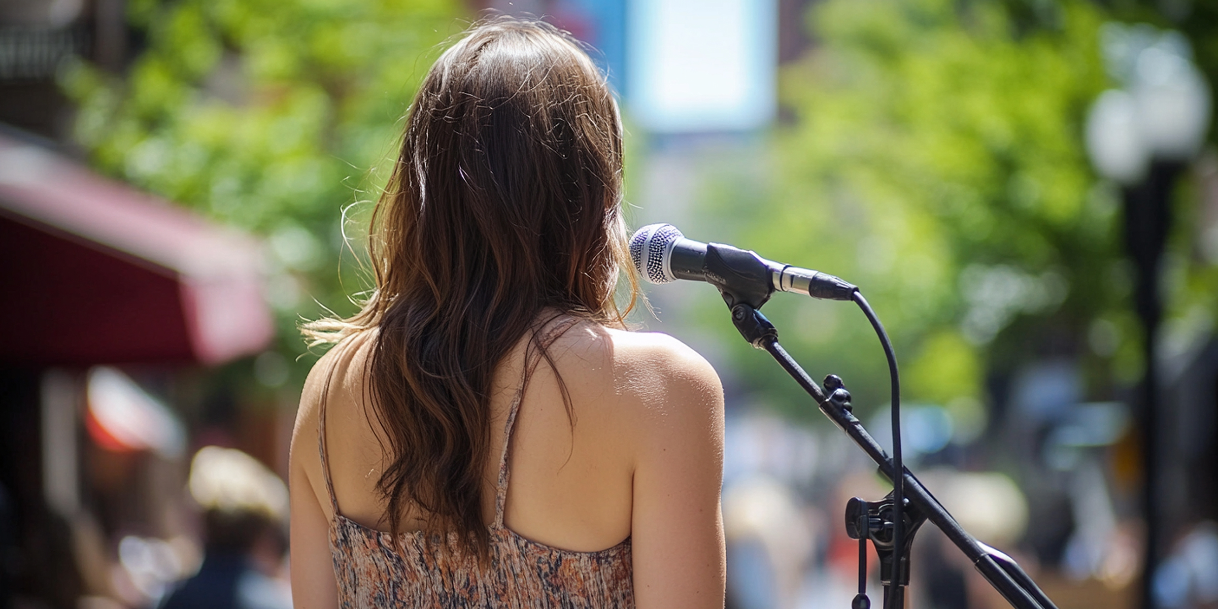 A woman standing near a mic | Source: AmoMama