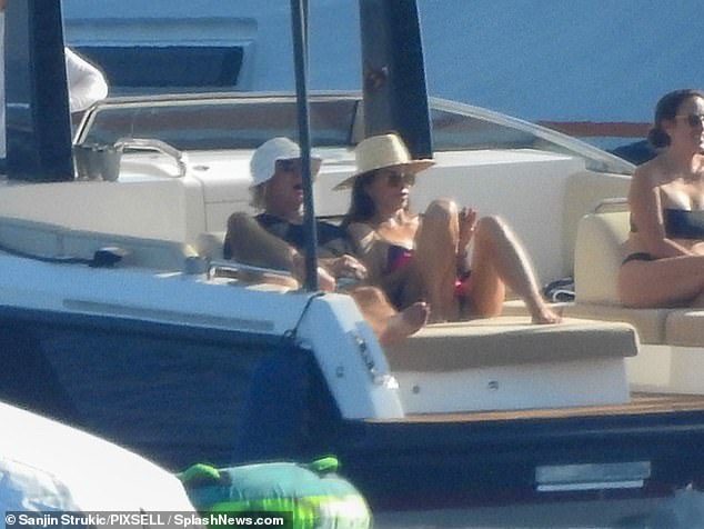 But they also found time to have some intimate downtime while on board, basking in the sun on a daybed