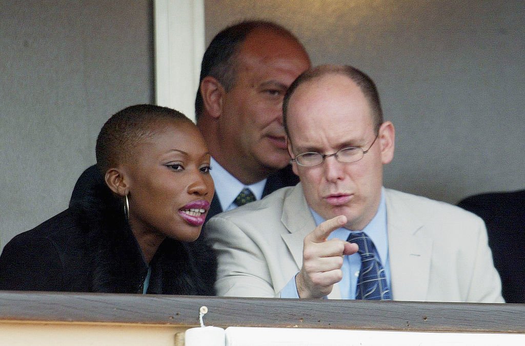 Prince Albert of Monaco chats with Nicole Coste while watching a match from his private box during the Monaco Tennis Open in April 2002 in Monaco.  |  Photo: Getty Images