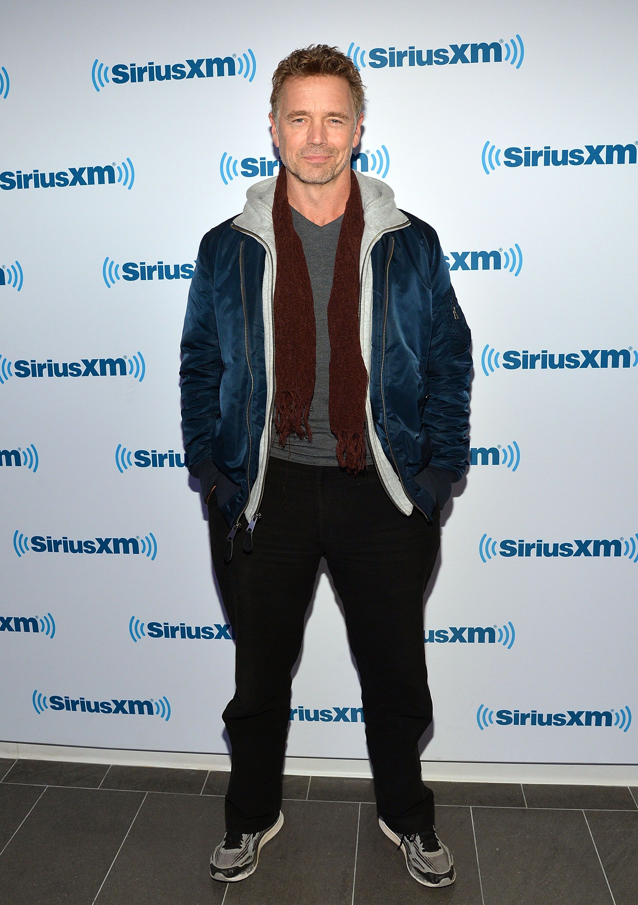 John Schneider visits SiriusXM Studios on December 3, 2014. | Photo: Getty Images