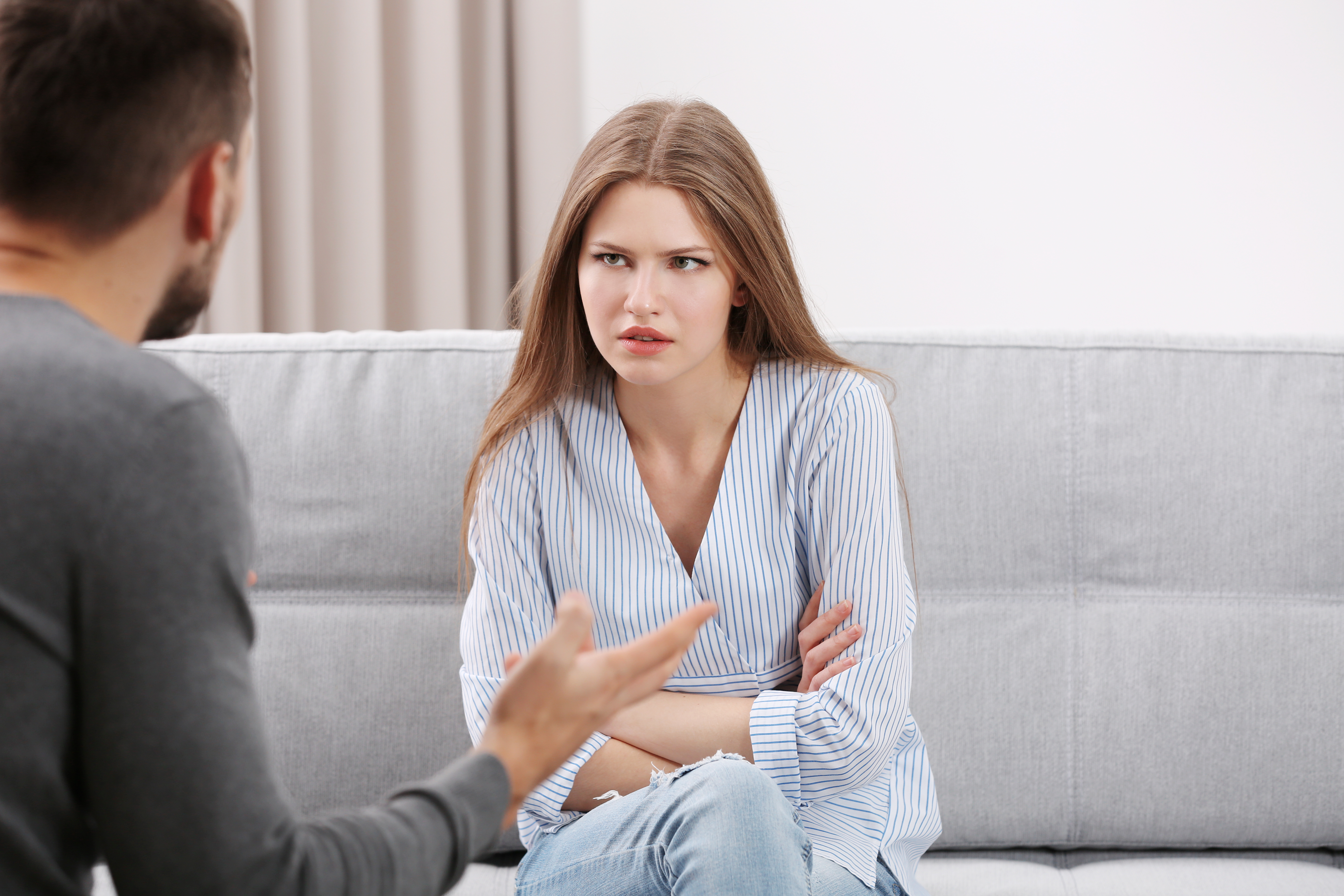 A man is pictured talking to his girlfriend at home | Source: Shutterstock