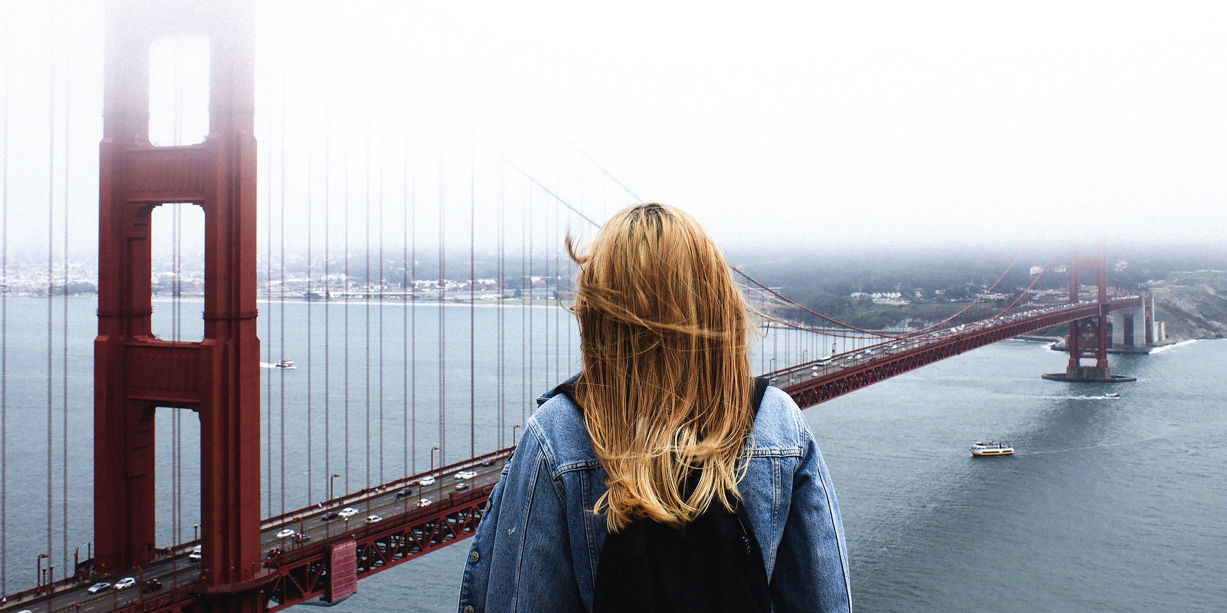 Unsplash | A woman overlooking the Golden Gate bridge