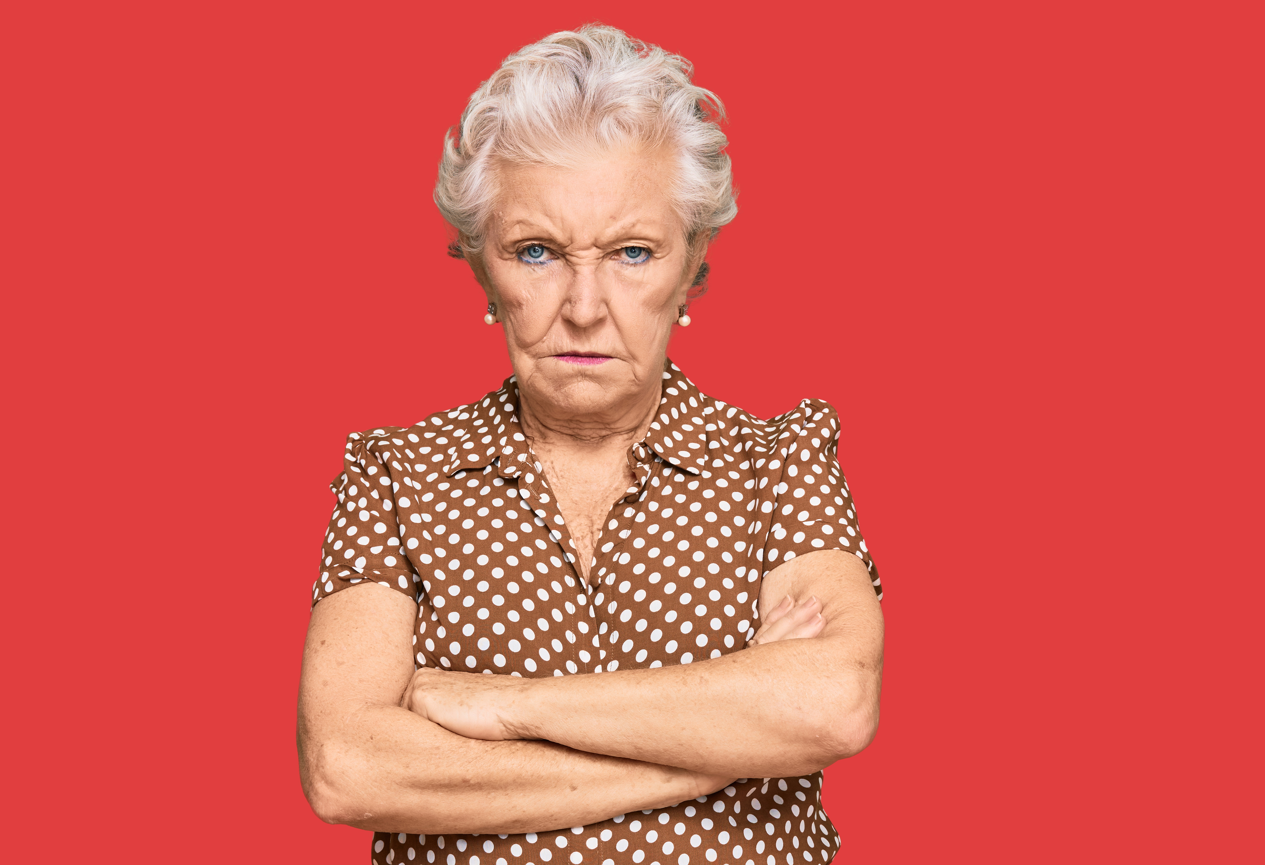 An angry elderly woman in casual clothes | Source: Shutterstock