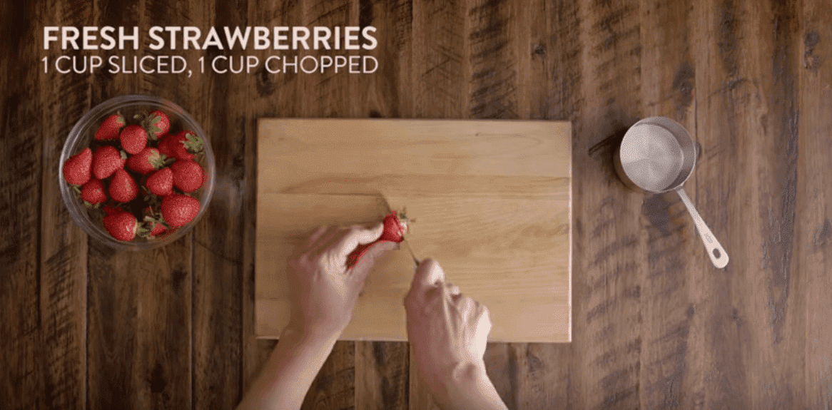 Slice the strawberries. Image credit: YouTube/Kraft Recipes