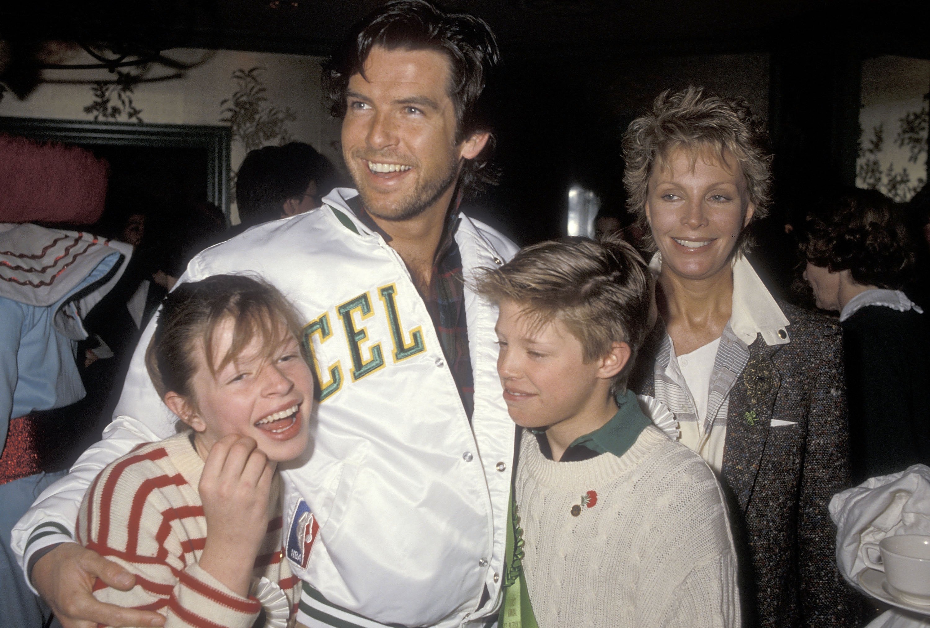 Actor Pierce Brosnan, wife Cassandra Harris, daughter Charlotte Harris and son Christopher Harris attend the First Annual Beverly Hills St. Patrick's Day Parade Celebrity Brunch on March 17, 1985 at Jimmy's Restaurant in Beverly Hills, California. | Source: Getty Images