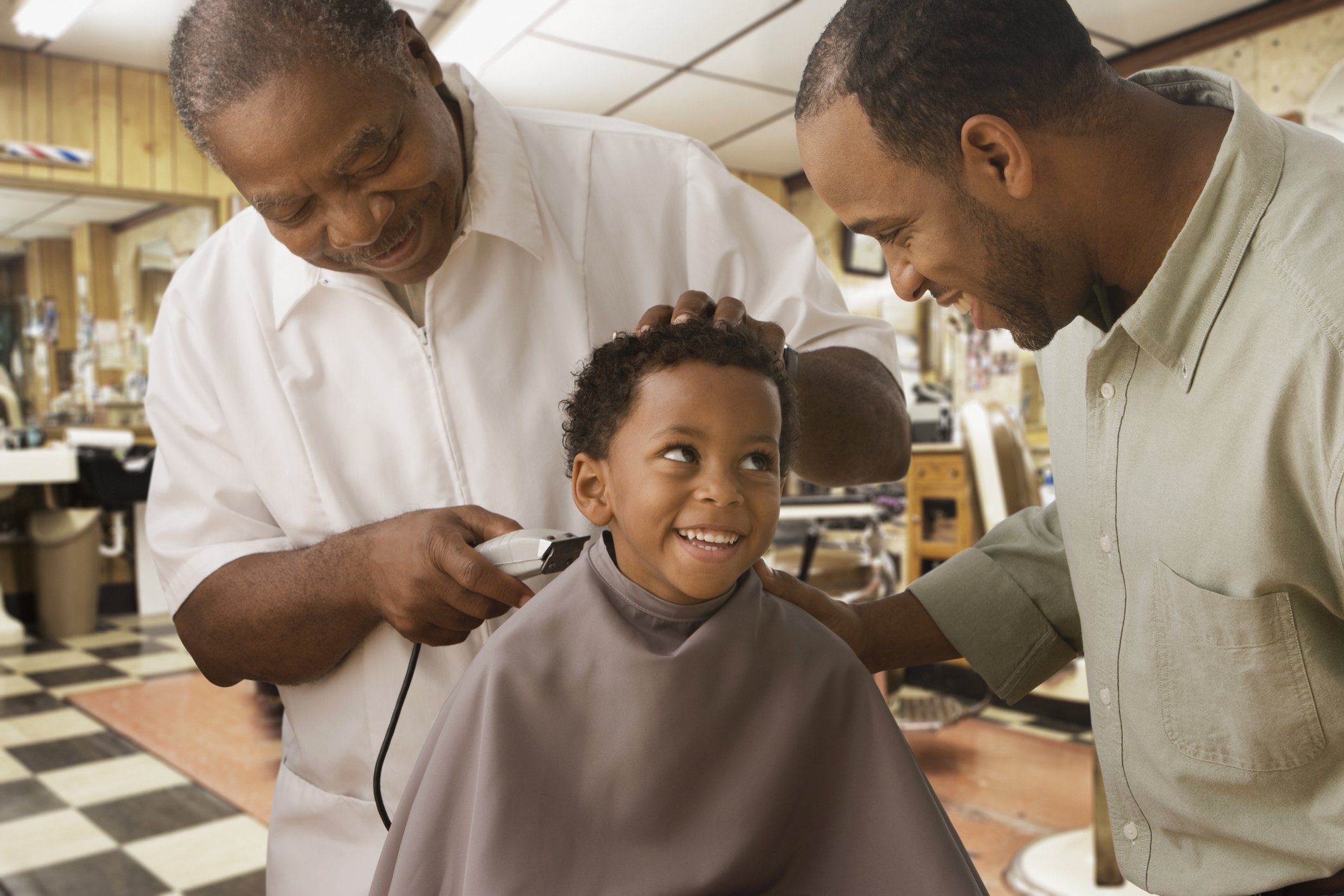 African father and son at barbershop | Photo: Getty Images