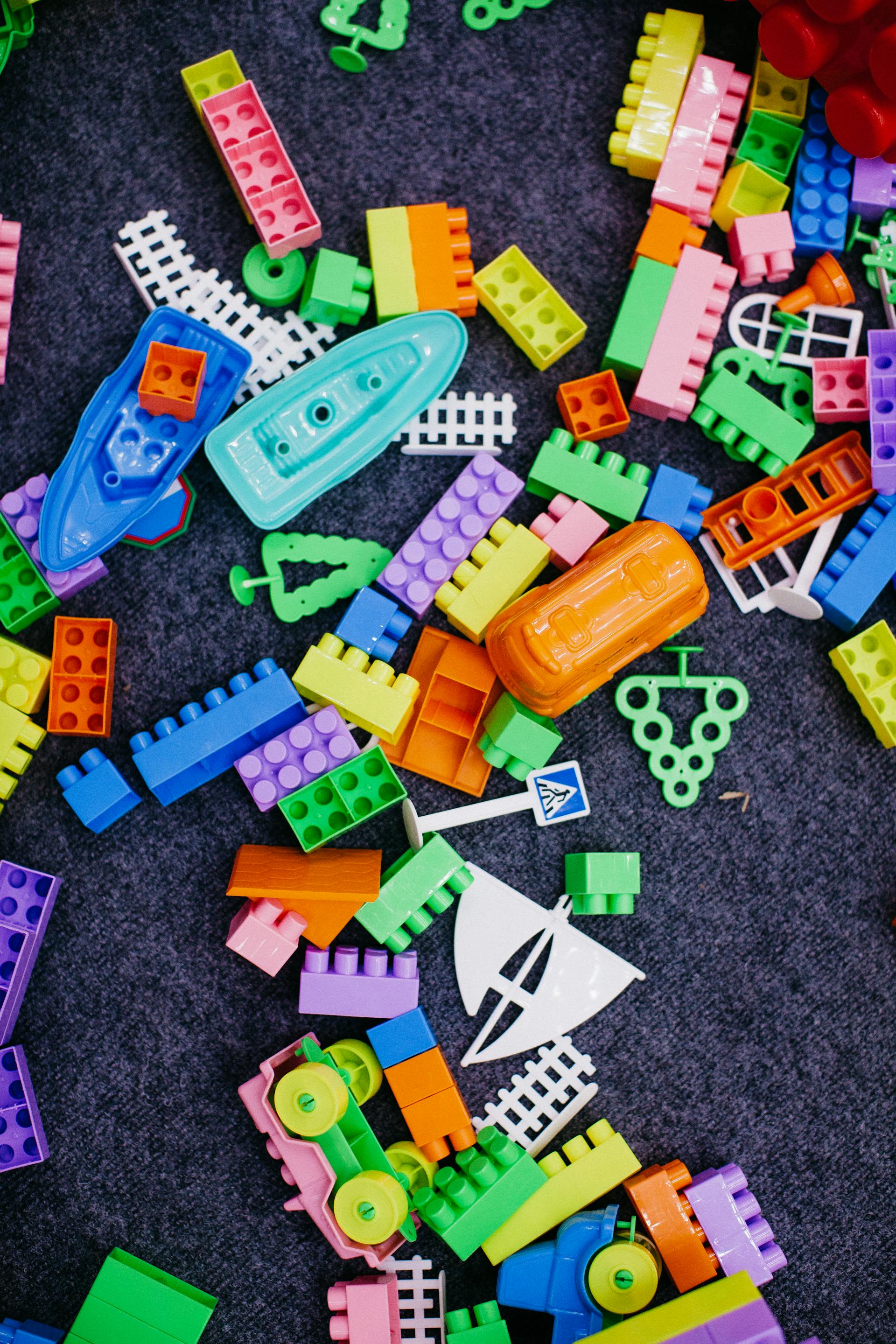 A closeup of toy blocks scattered on the floor | Source: Pexels