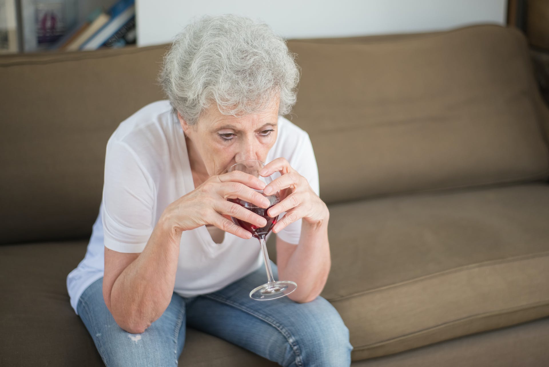 Old woman drinking wine | Source: Pexels