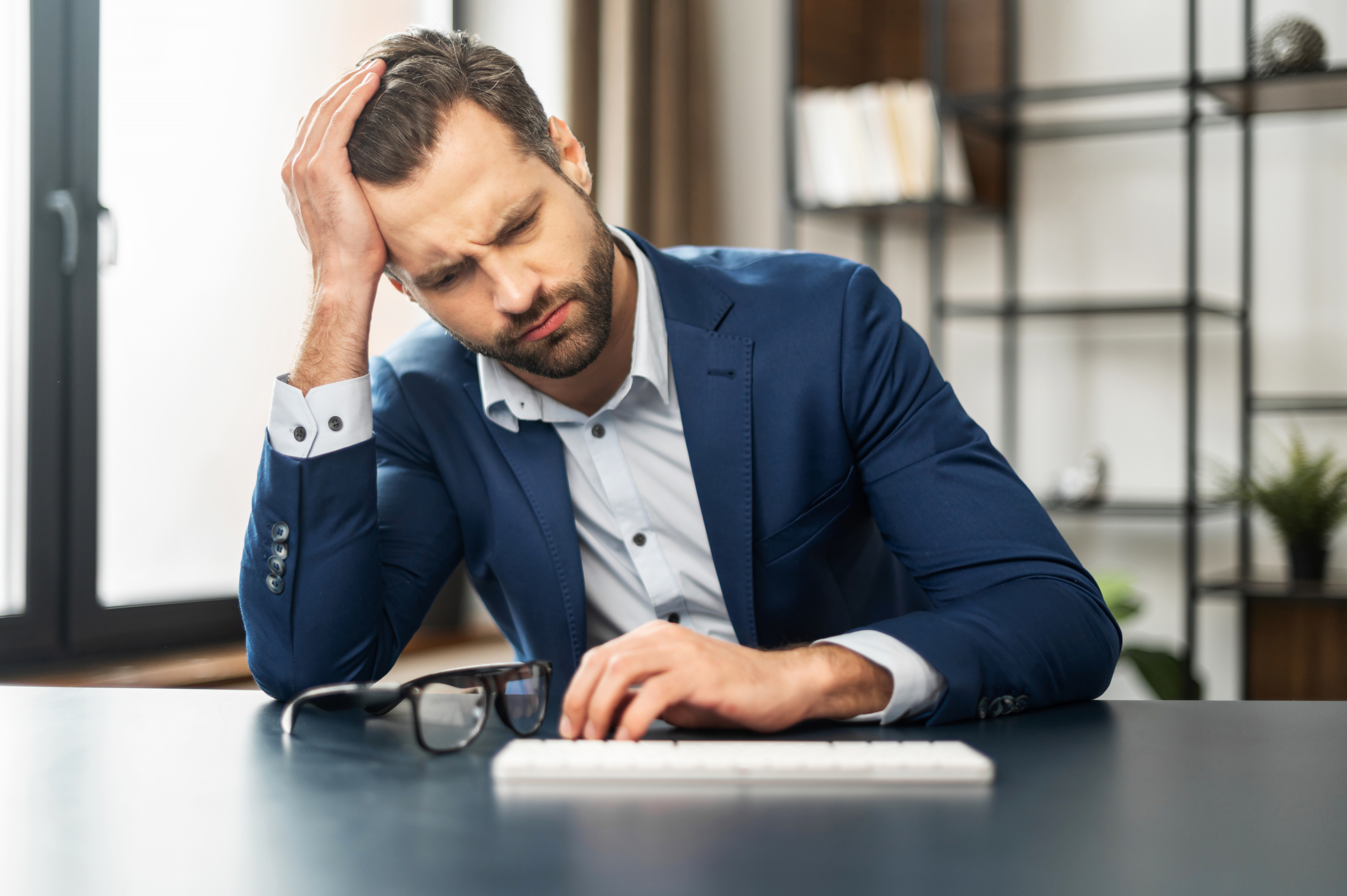 Man stressed at work | Source: Shutterstock